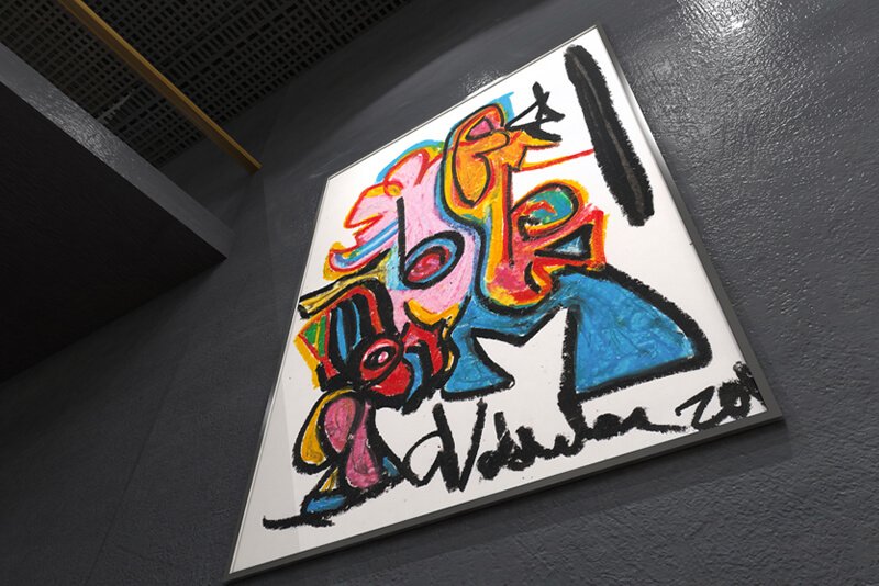 A pastel hung on a dark art gallery wall called "Pablo."