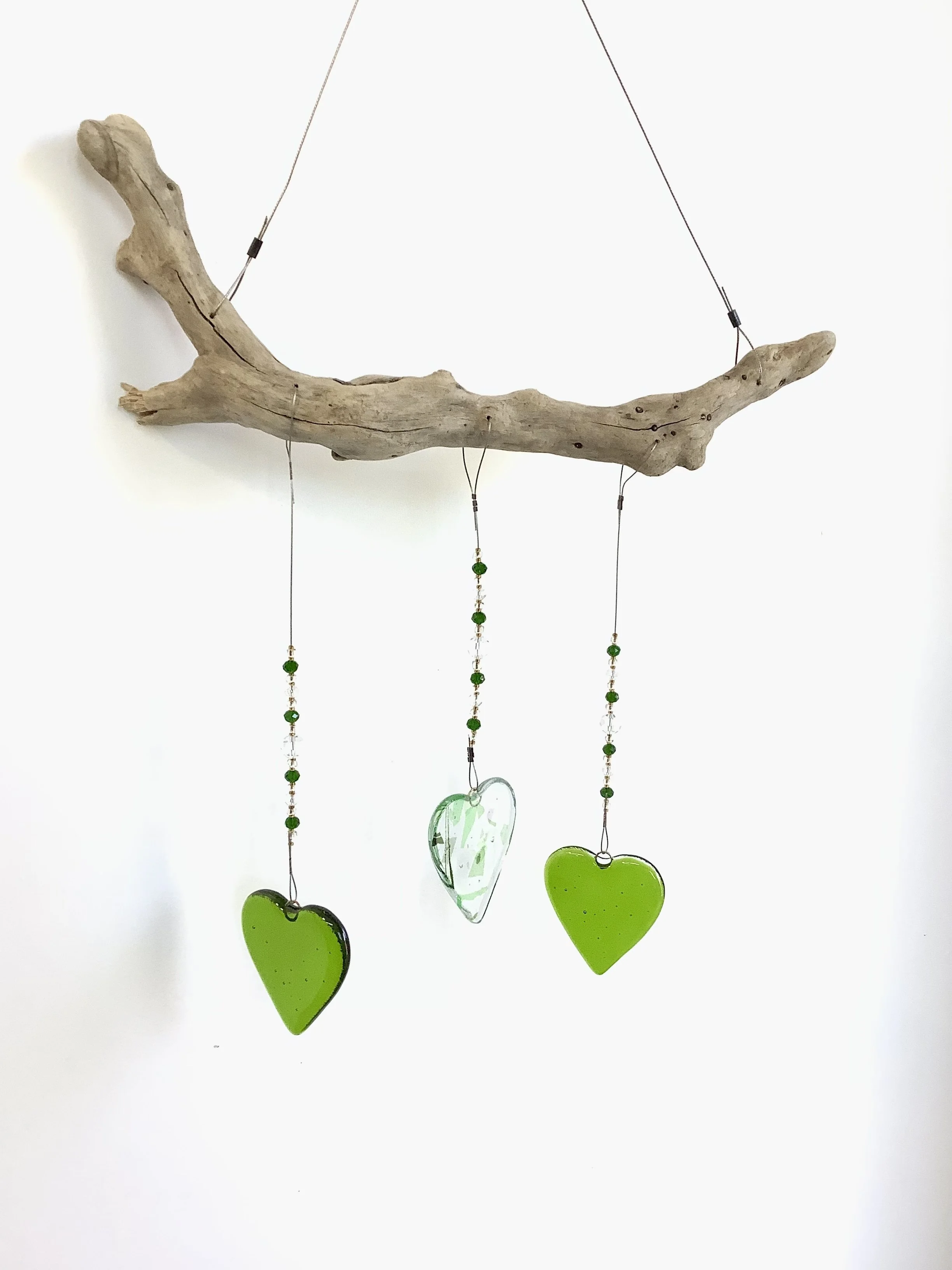 $75
Green fused glass heart mobile with green, gold, and clear beads. Hangs 22"x12" from stainless wire and Vancouver Island driftwood. Contact to purchase.