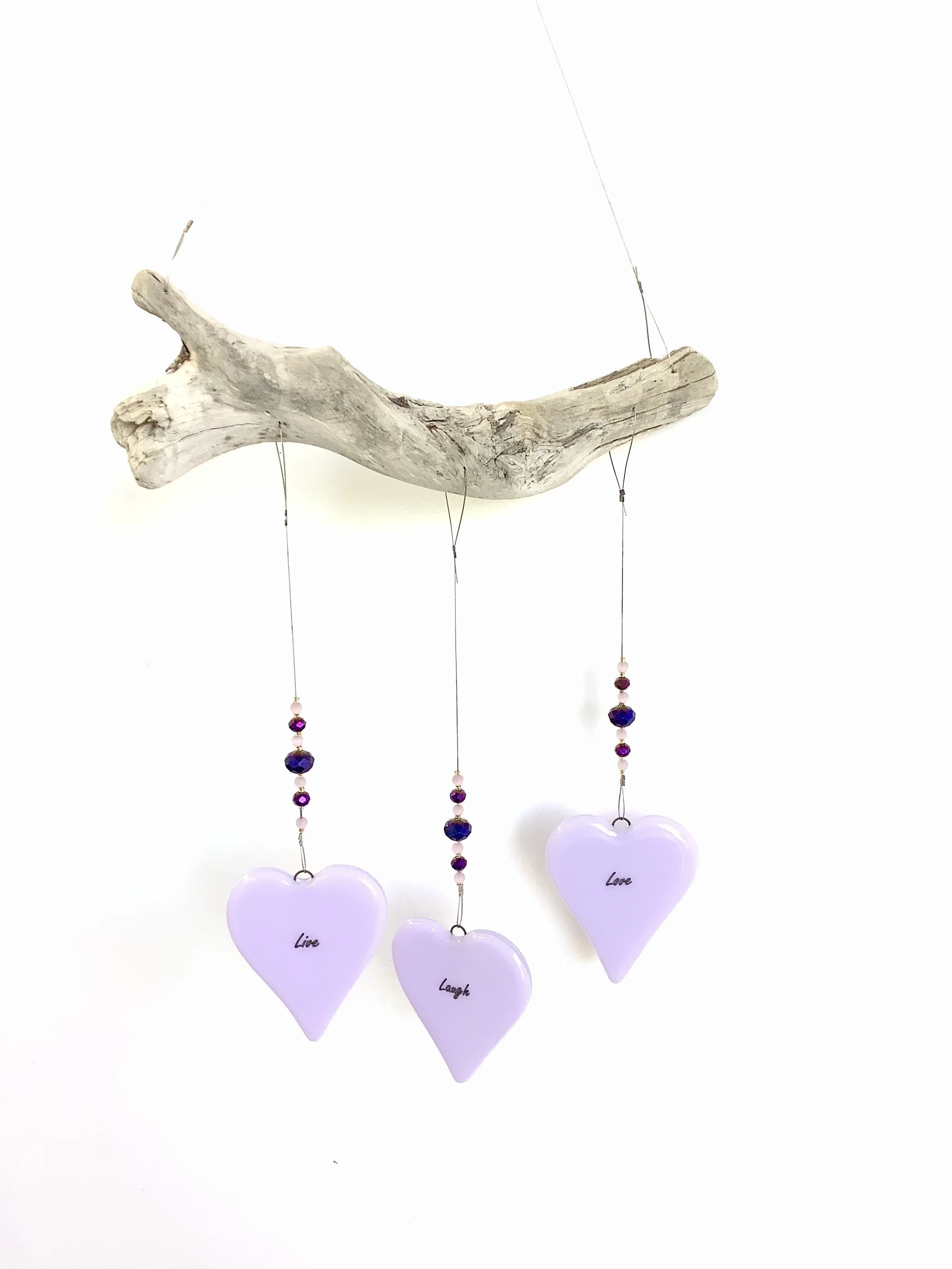 SOLD
$80
Live, Laugh, Love pink fused glass hearts with pink, gold, and iridescent purple beads. Hangs 21"x8" from stainless wire and Vancouver Island driftwood. Contact to purchase.