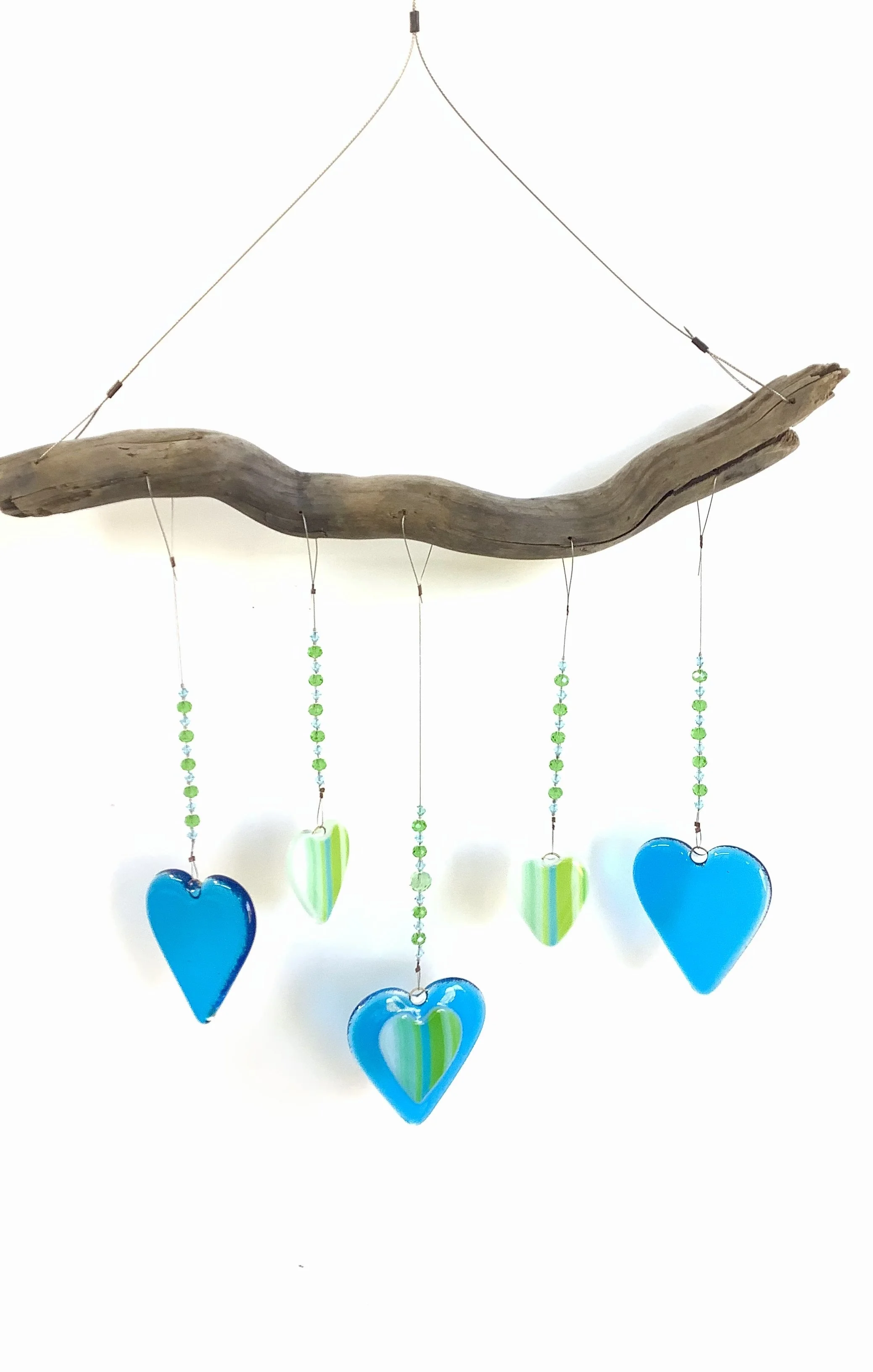 $90
Blue and green swirly fused glass hearts with  blue and green beads. Hangs 20"x13" from stainless wire and Vancouver Island driftwood. Contact to purchase.