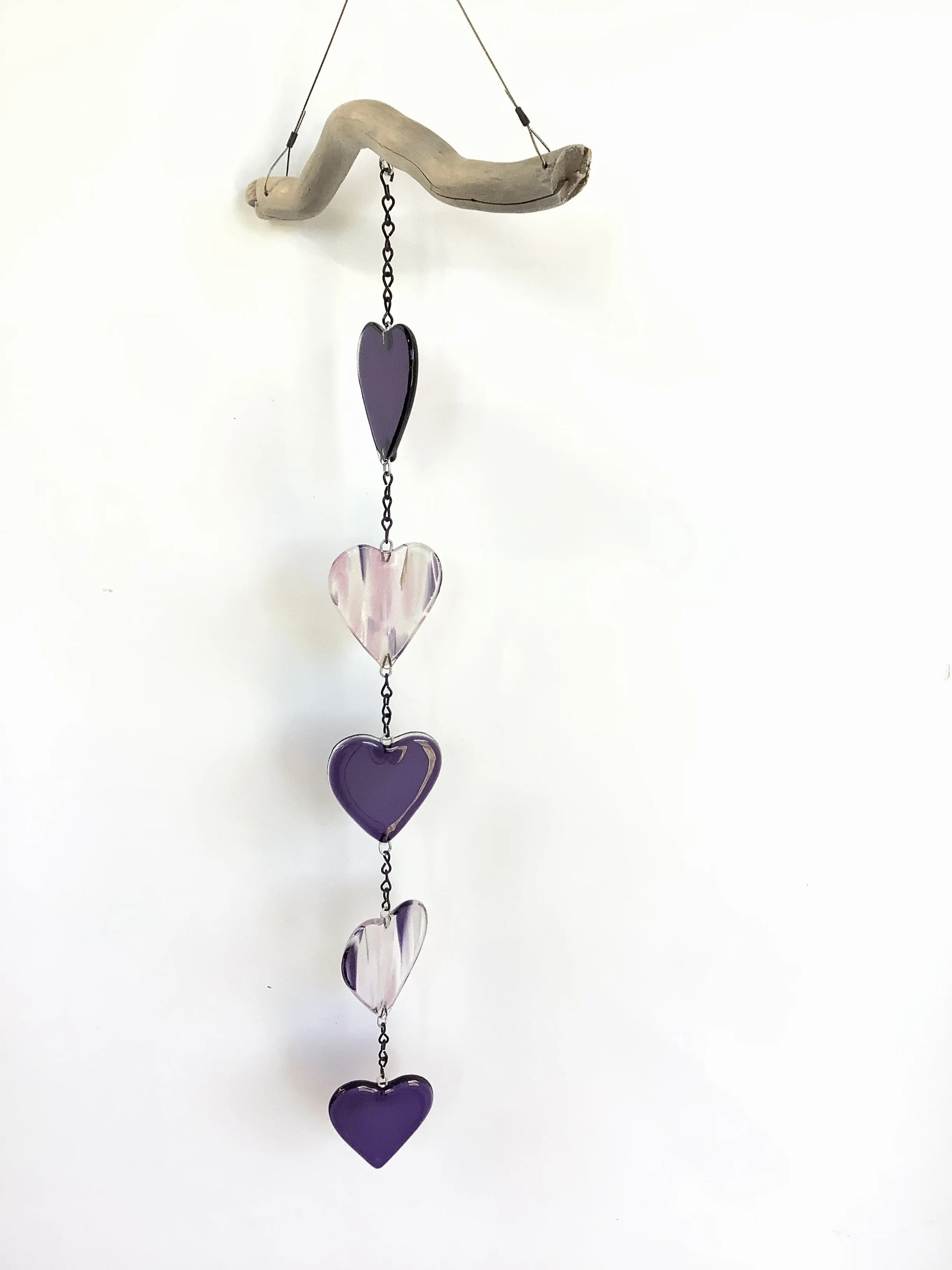 $100
Pink and purple fused hearts. Hangs 25" from chain and Vancouver Island driftwood. Contact to purchase.