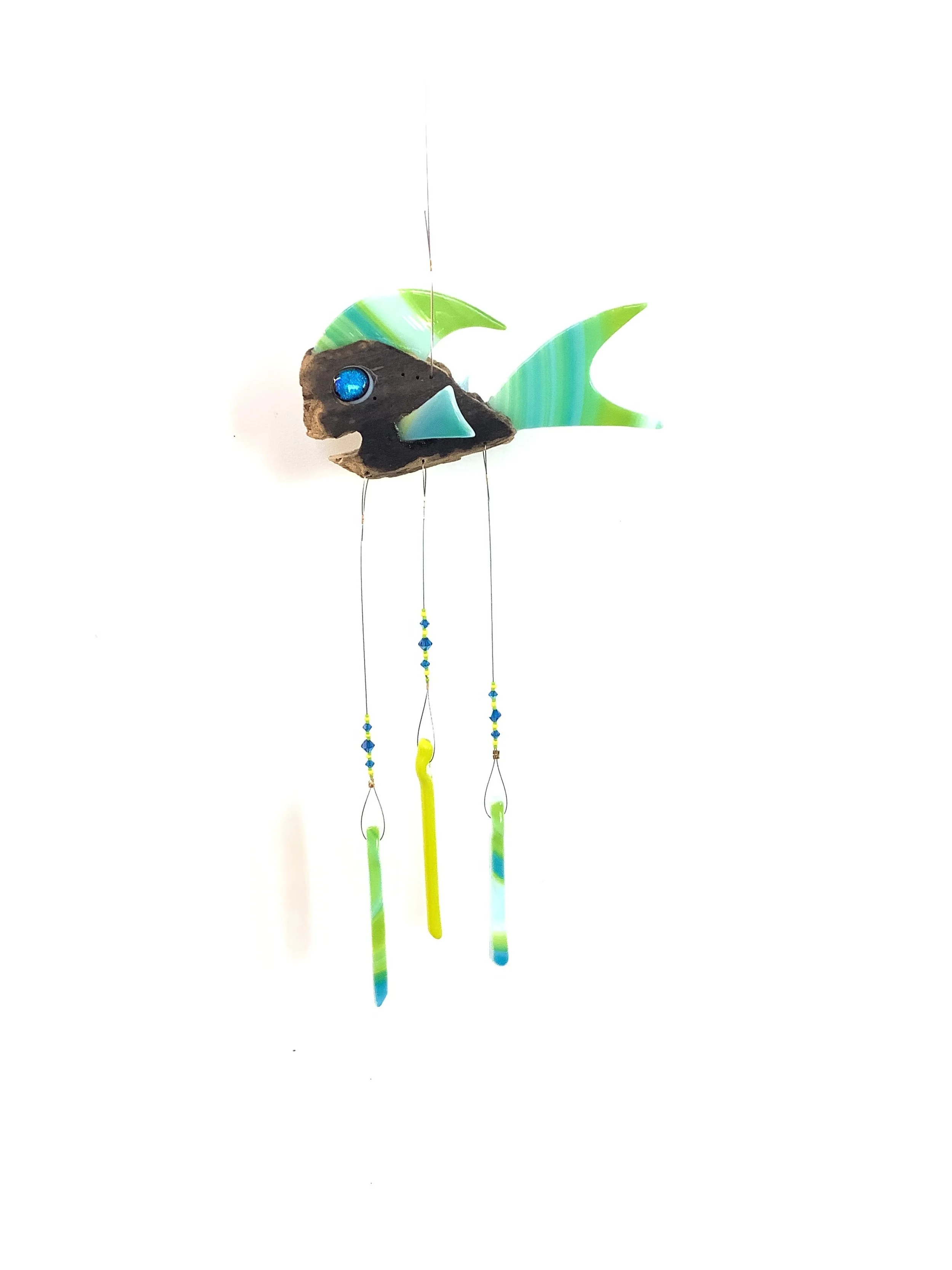 $50 "Sloop Dog"  Blue and green swirly fused glass driftwood fish chime with blue ,green, and yellow beads. Hangs 21"x6" from stainless wire with fused glass chimes. Contact to purchase.