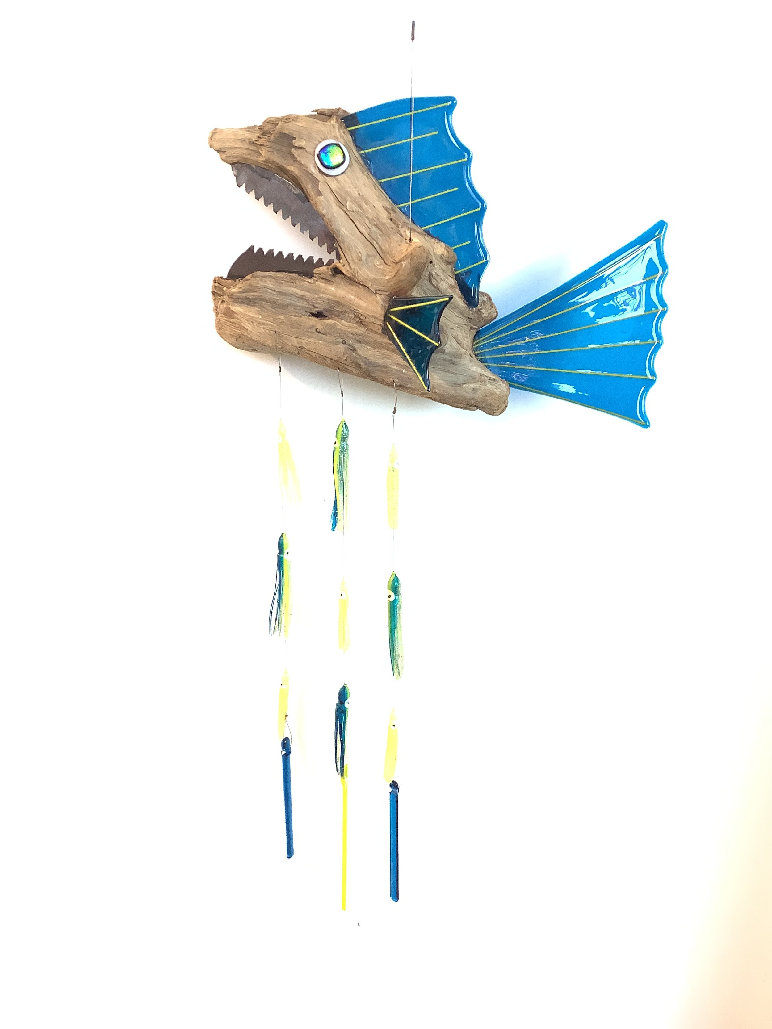 $175 " I chews you" Medium blue fused glass driftwood fish chime with blue and yellow hoochies and fused glass chimes. Hangs 41"x16" from stainless wire. Contact to purchase.