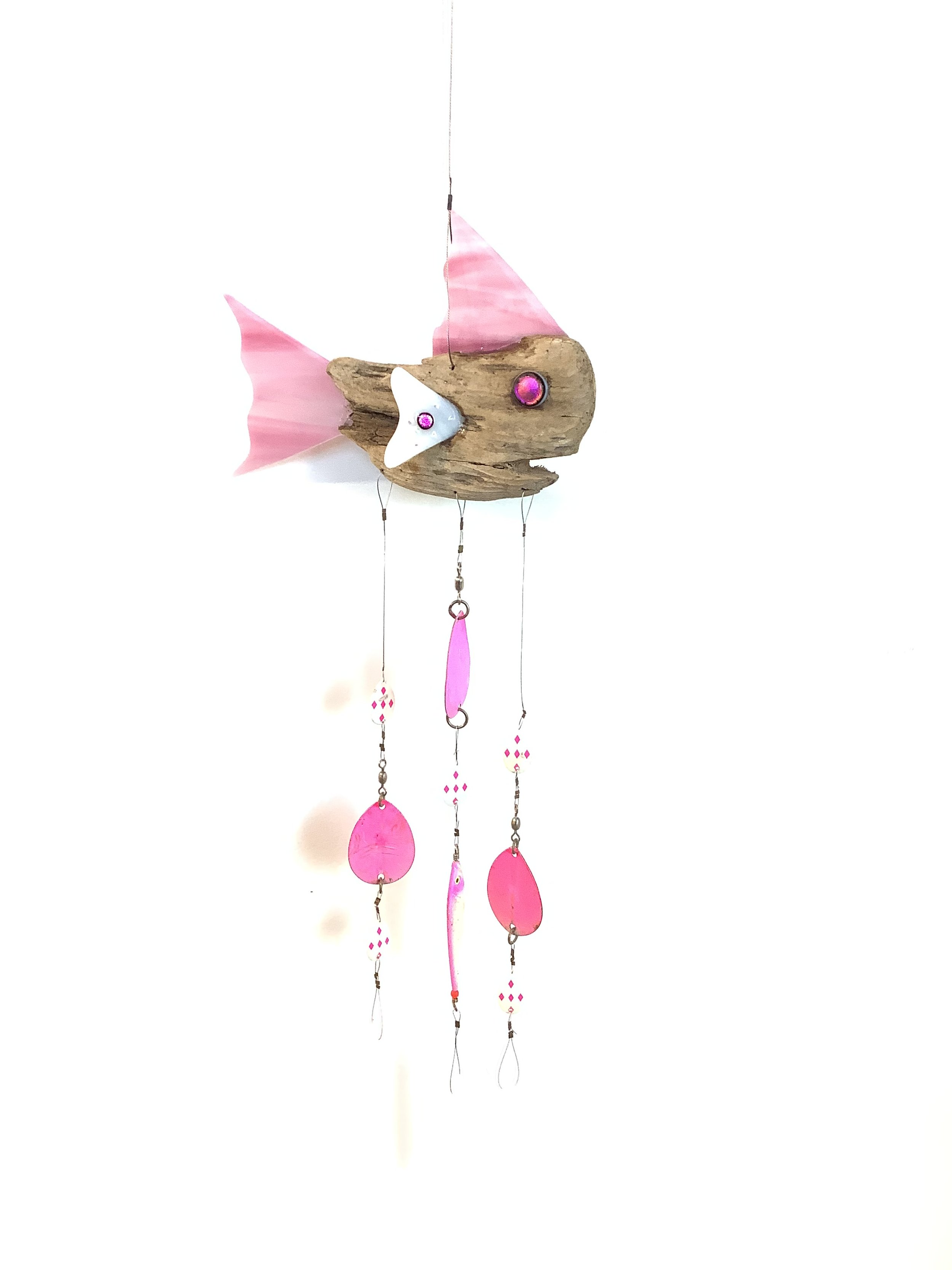 $125 "Prawnstar" Pink fused glass driftwood fish chime with pink fishing lures and white fused glass chimes. Hangs 31"x8" on stainless wire. Contact to purchase.