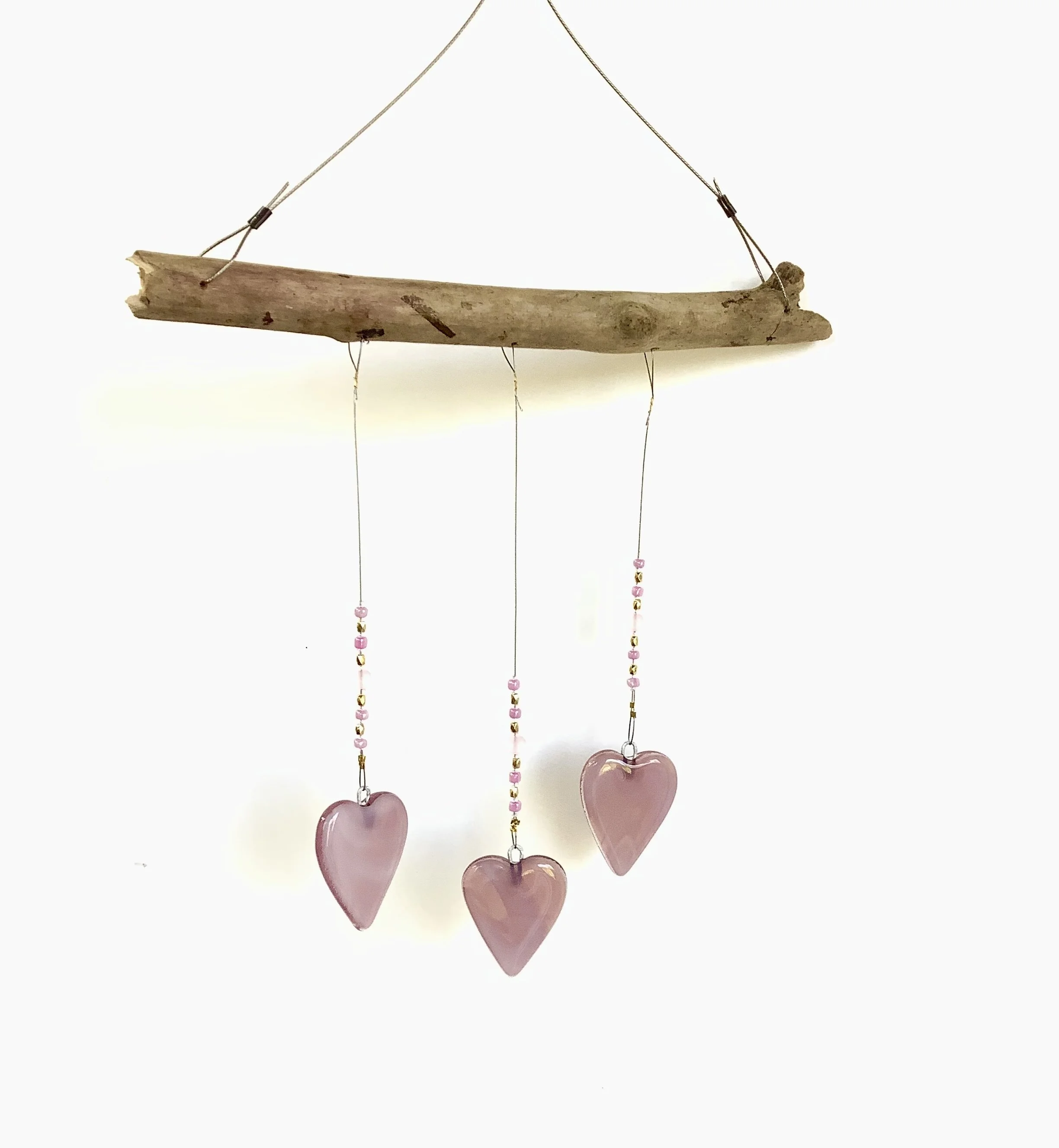 SOLD   $45
Rose pink fused glass hearts with pink and gold beads. Hangs 15"x8" from stainless wire and Vancouver Island driftwood. Contact to purchase.