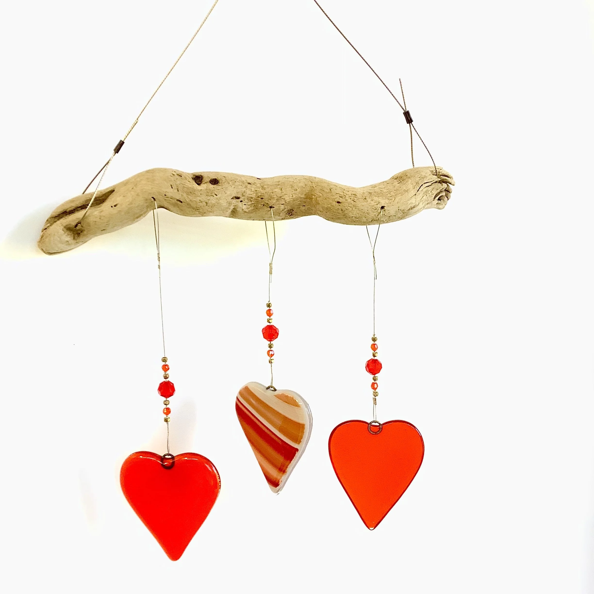 Orange fused glass heart mobile with orange, gold, and clear beads. Hangs 16"x9" from stainless wire and Vancouver Island driftwood. Contact to purchase.