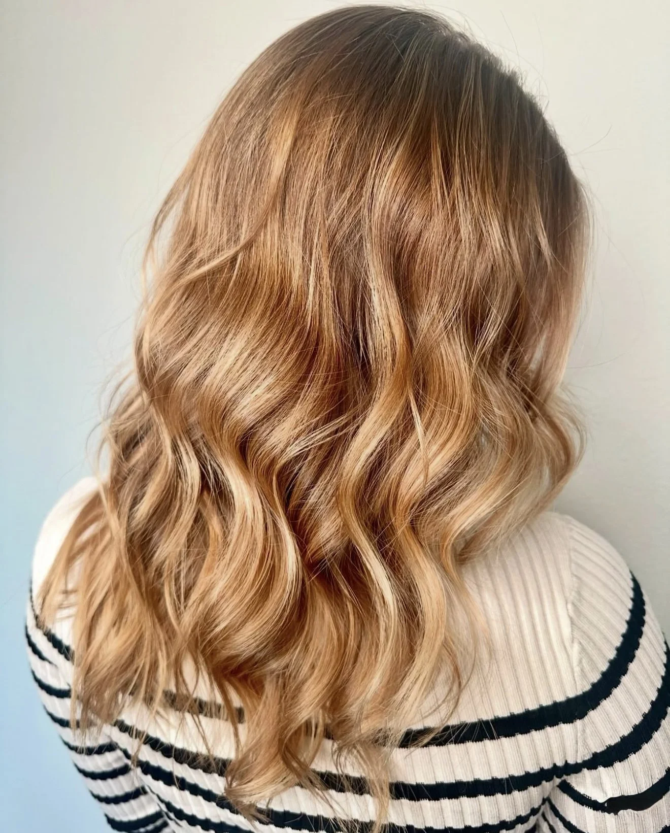 A sun‑kissed blonde balayage by Marissa, blending soft, natural highlights for a low‑maintenance, luminous look. Perfect for adding brightness and dimension while keeping a seamless grow‑out. 