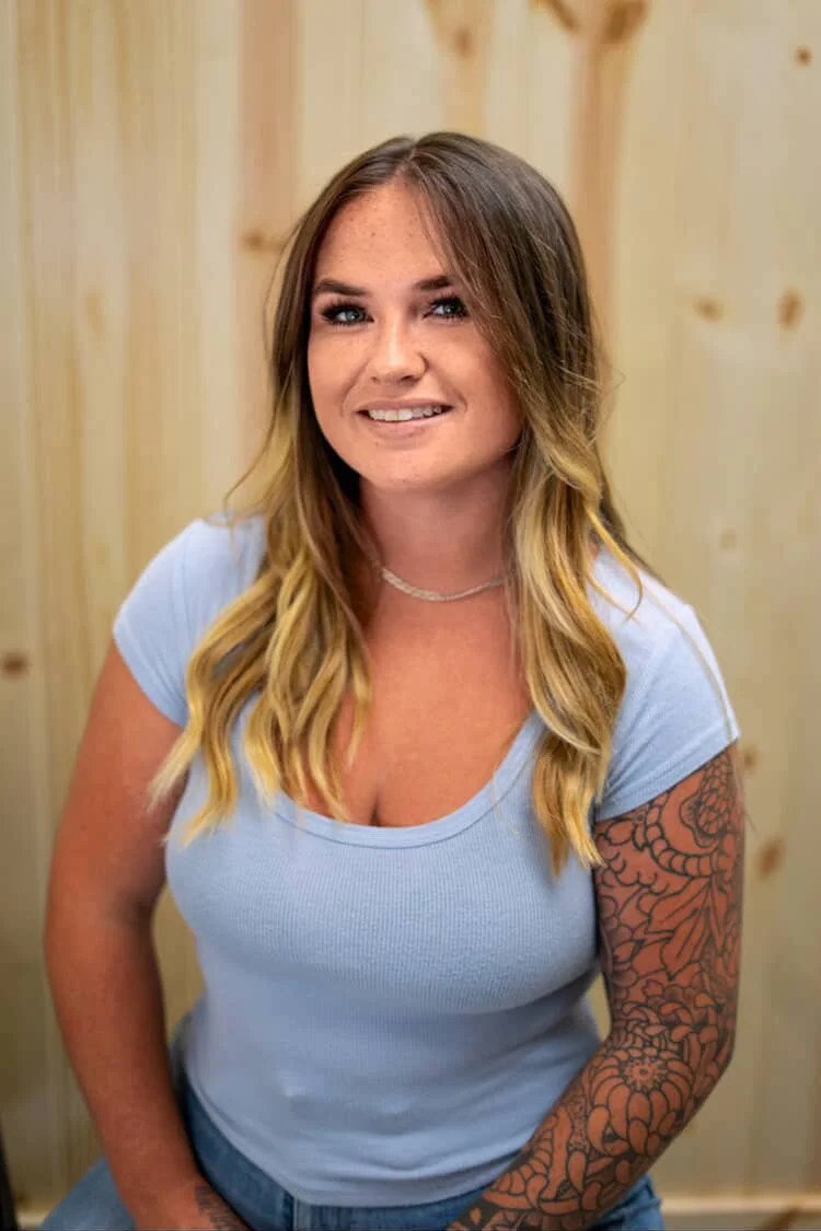 Presley, junior hairstylist at The Co‑Artist Studio in Capitola, California, specializing in blowouts, layered haircuts, and blonde hair services