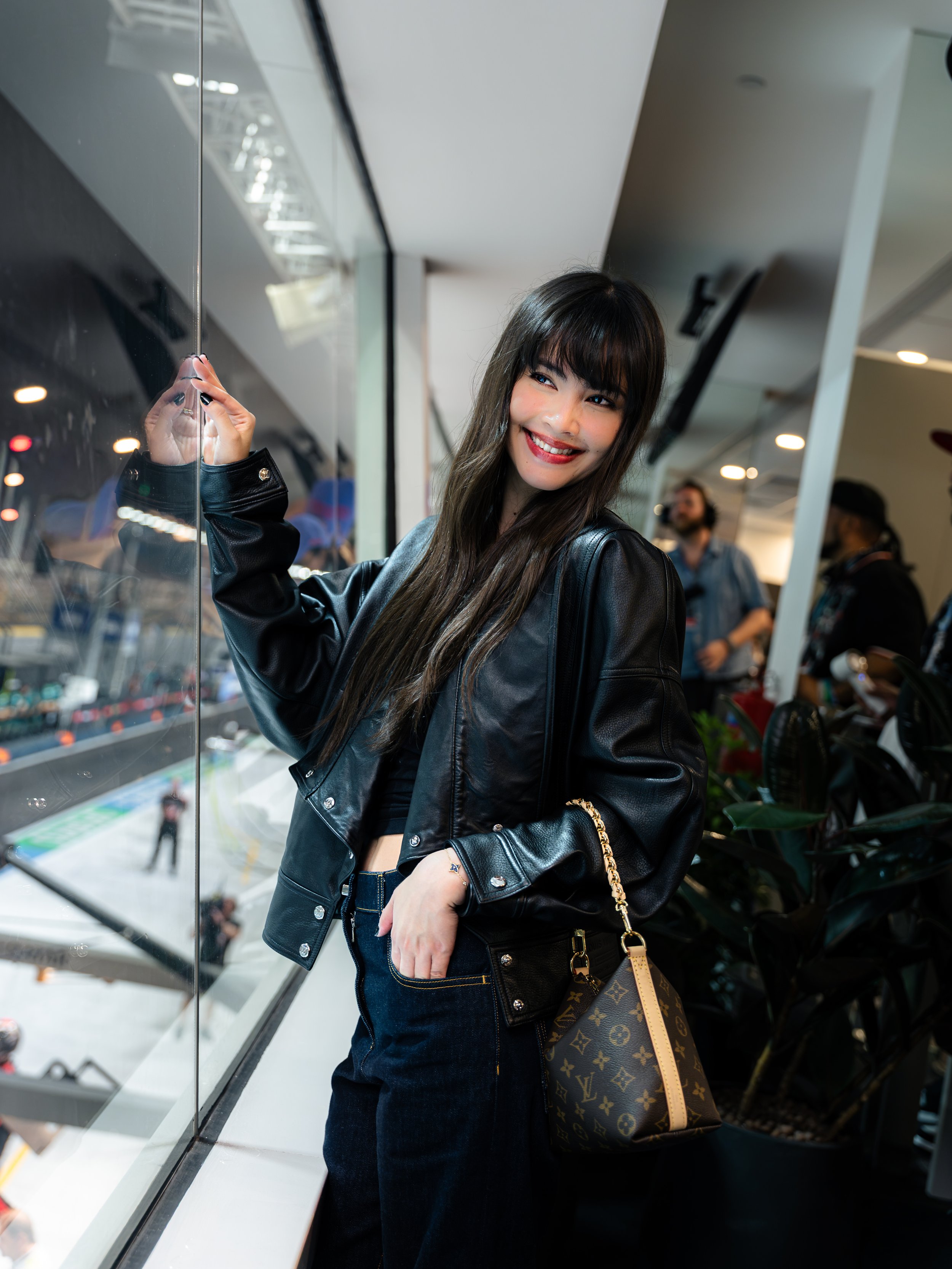 Celebrity event photography in Singapore by Han Yang Tay Photography, capturing Thai actress Yaya Urassaya at the exclusive Louis Vuitton LVMH Suite during the Formula 1 Singapore Grand Prix 2026, with stunning views of the race circuit from the Padd