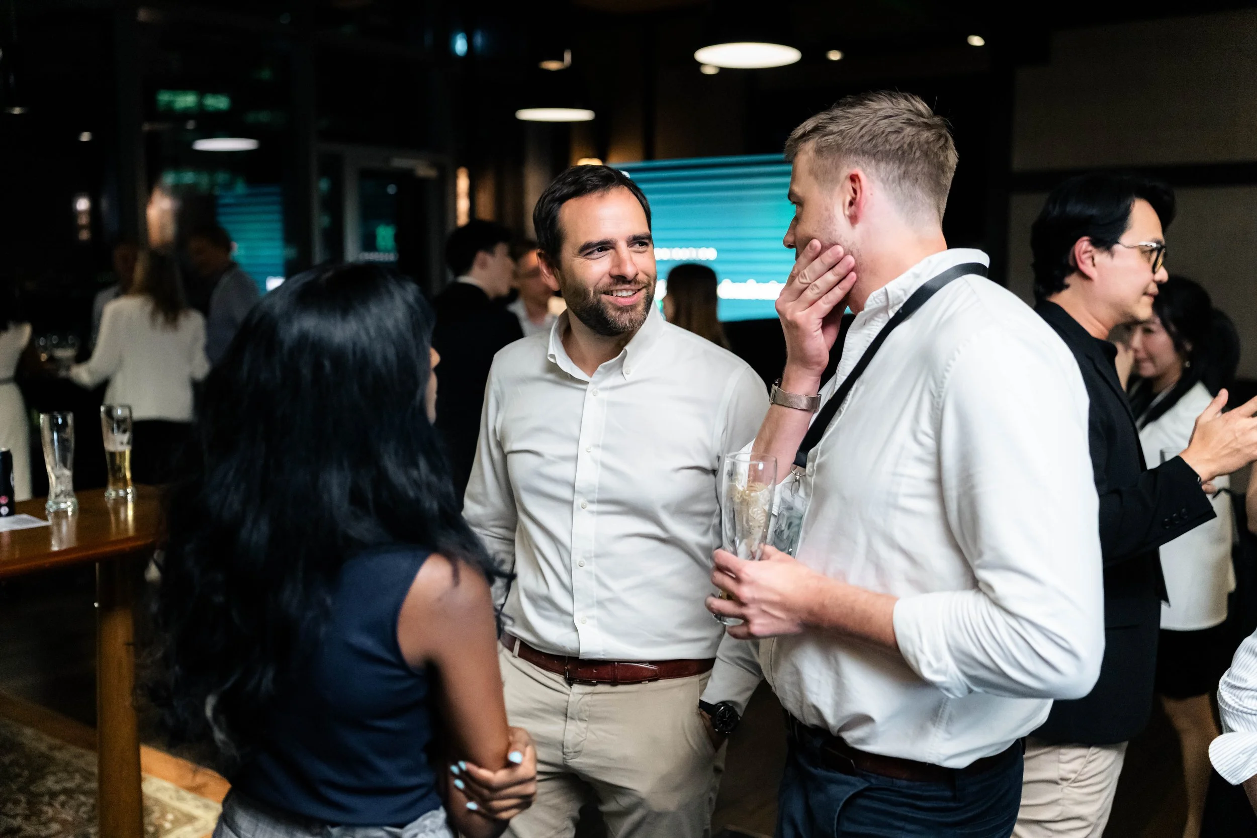 Corporate event photography in Singapore by Han Yang Tay Photography, capturing candid guest interactions at the Motion Ventures Singapore Maritime Week 2026 event.