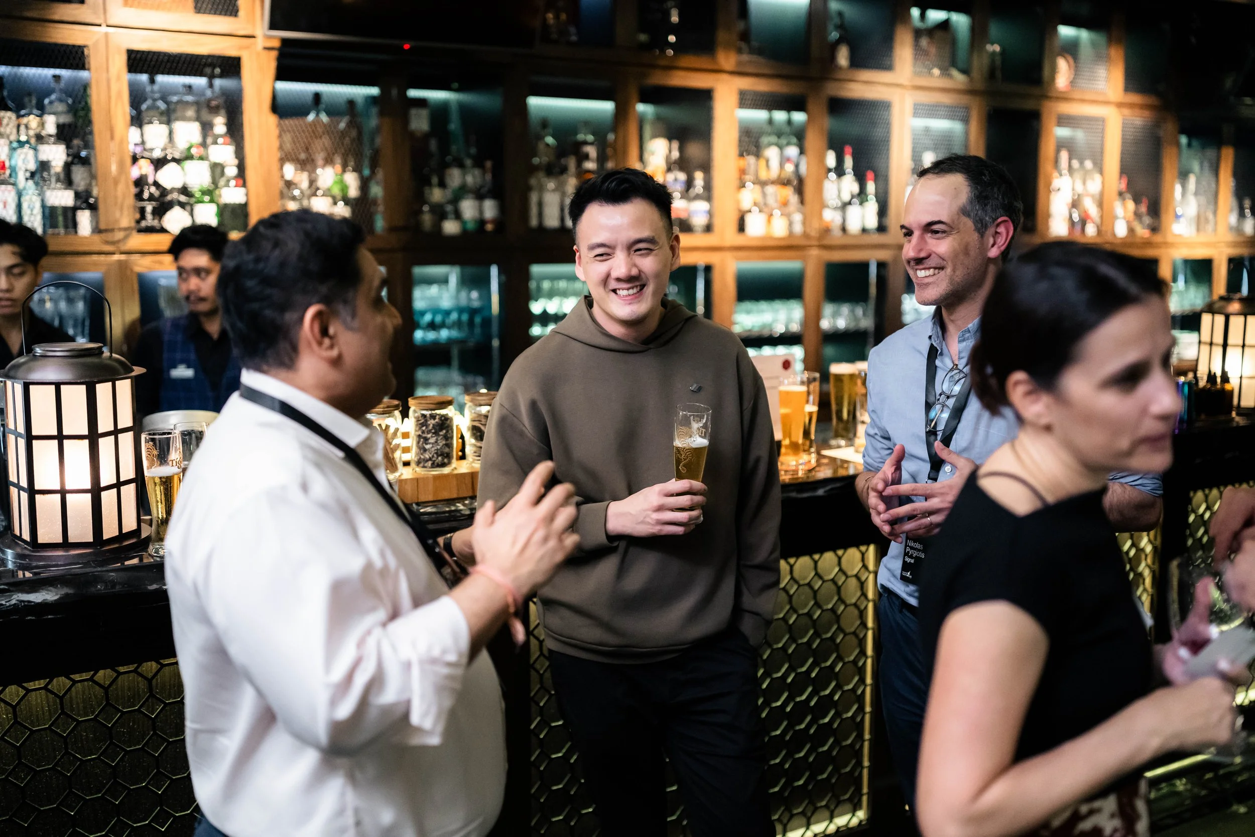 Corporate networking event photography in Singapore by Han Yang Tay Photography, capturing guests in conversation at the Motion Ventures event during Singapore Maritime Week 2026.
