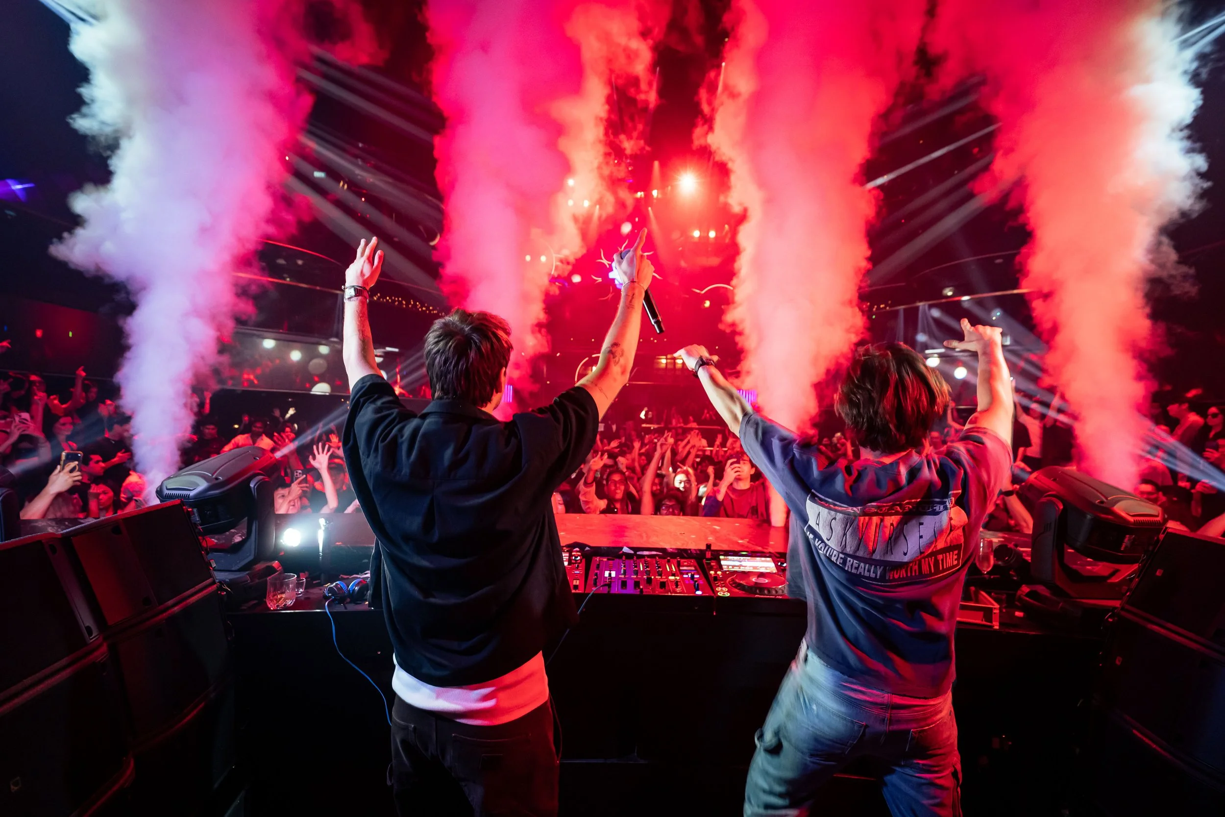 DJ Lucas & Steve performing live at Marquee Singapore as CO2 cannons erupt above a packed crowd, creating an electrifying electronic dance music atmosphere with immersive stage production.