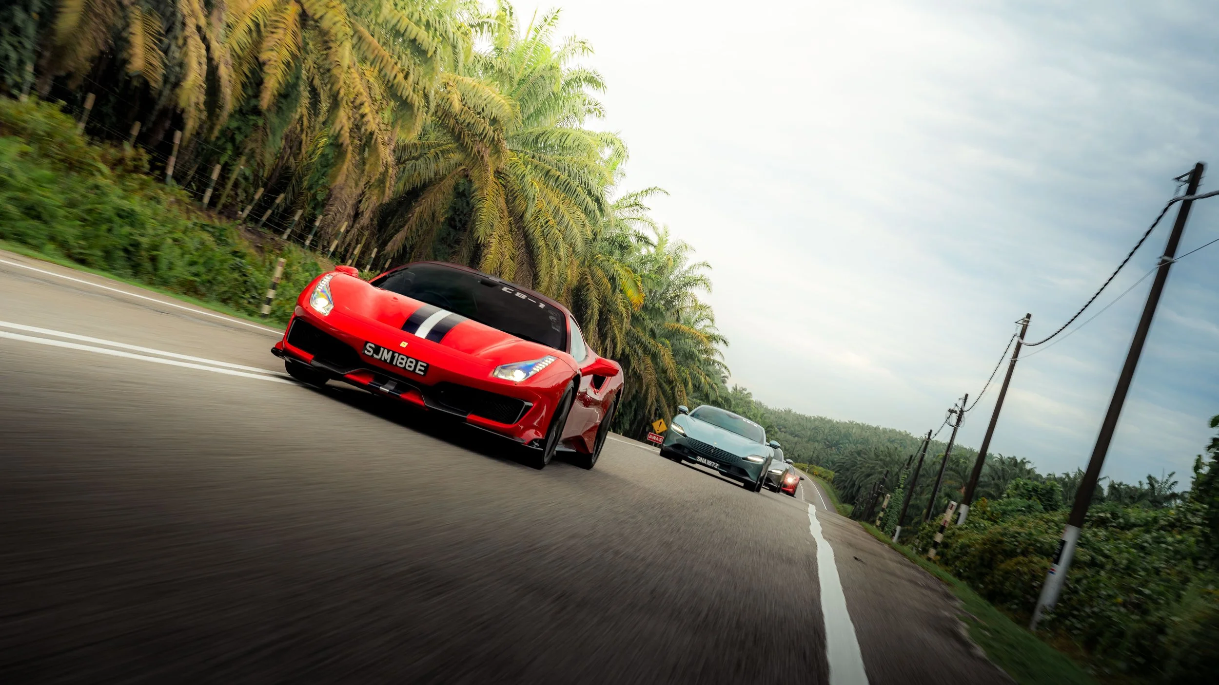 Automotive photography by Han Yang Tay Photography, capturing a Ferrari convoy during a Ferrari Owners Club Singapore overseas drive.