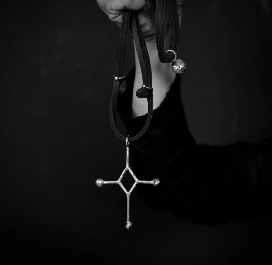 BRASS CROSS, LEATHER PENDANT NECKLACE $160.00
