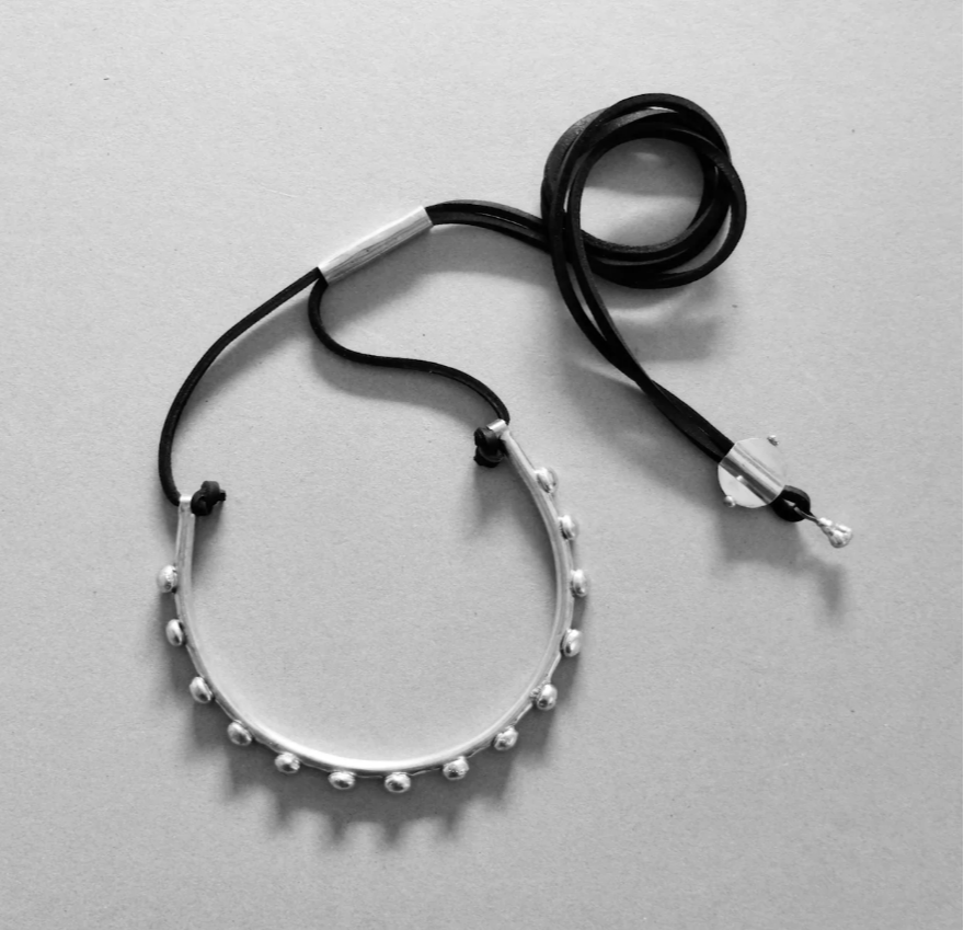 BRASS HOOP, LEATHER NECK PIECE $195.00
