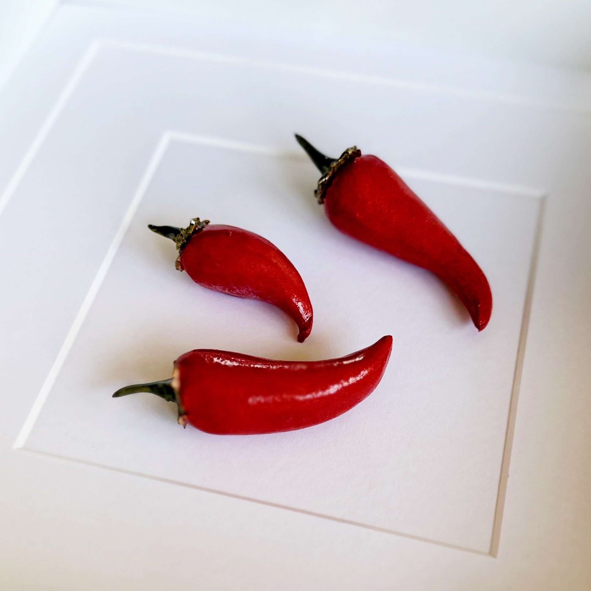 handmade ceramic kitchen wall art - red chillies