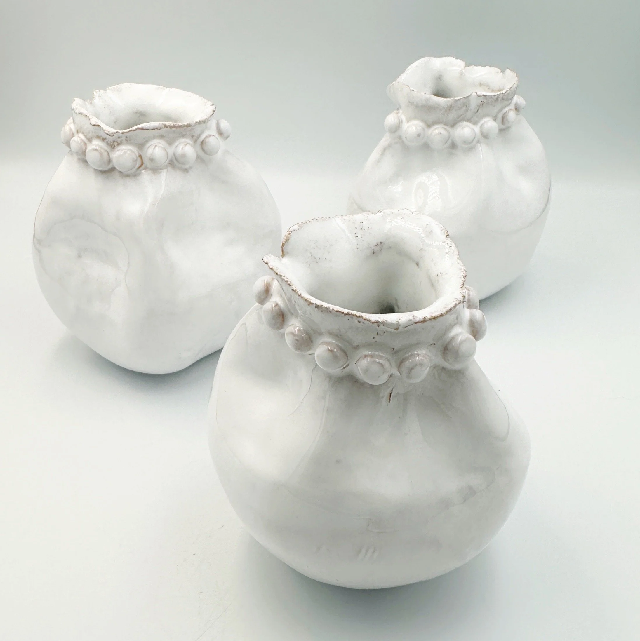 small white ceramic bud vases