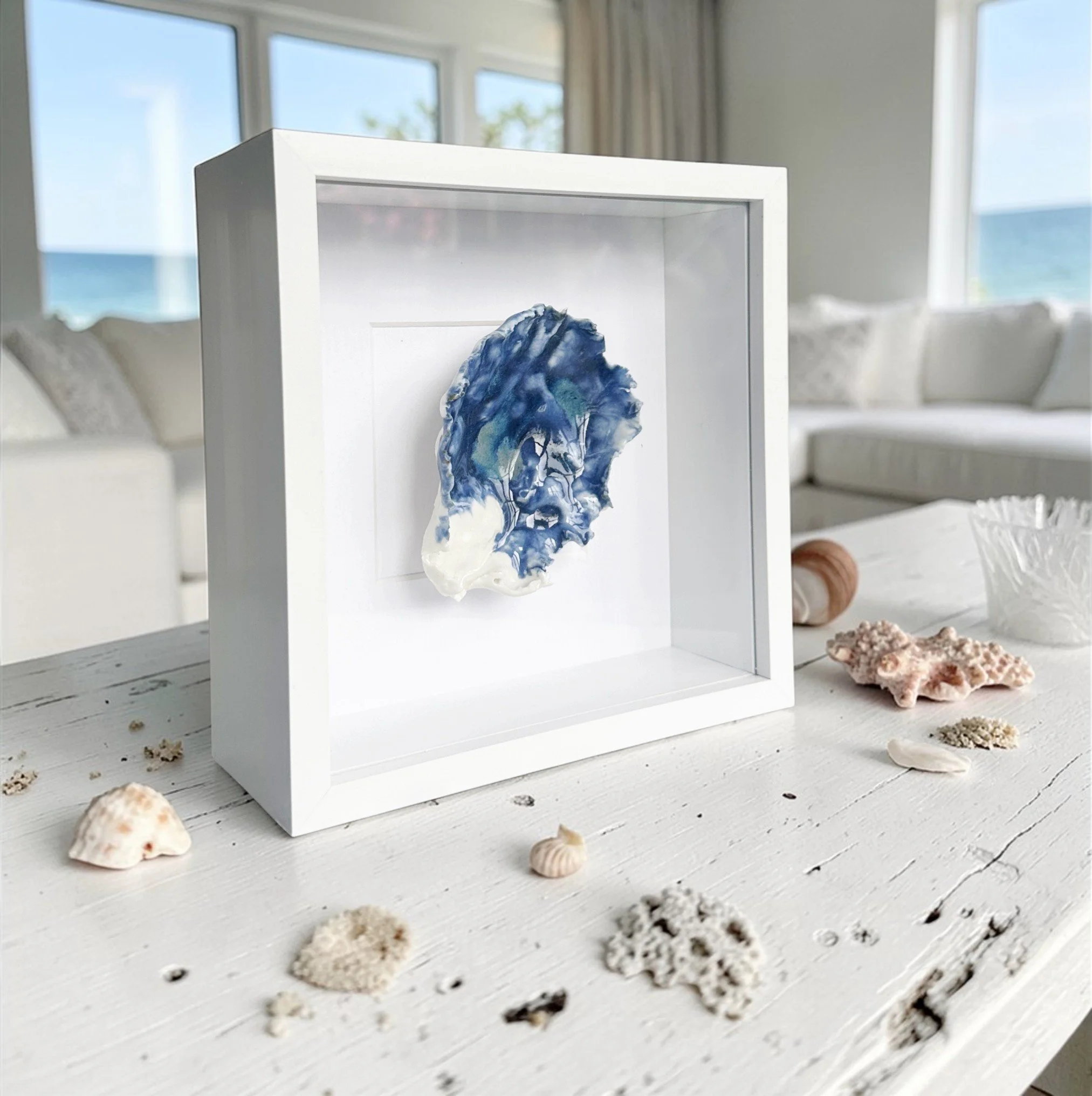 Elegant textured coastal wall art featuring sculpted porcelain shells