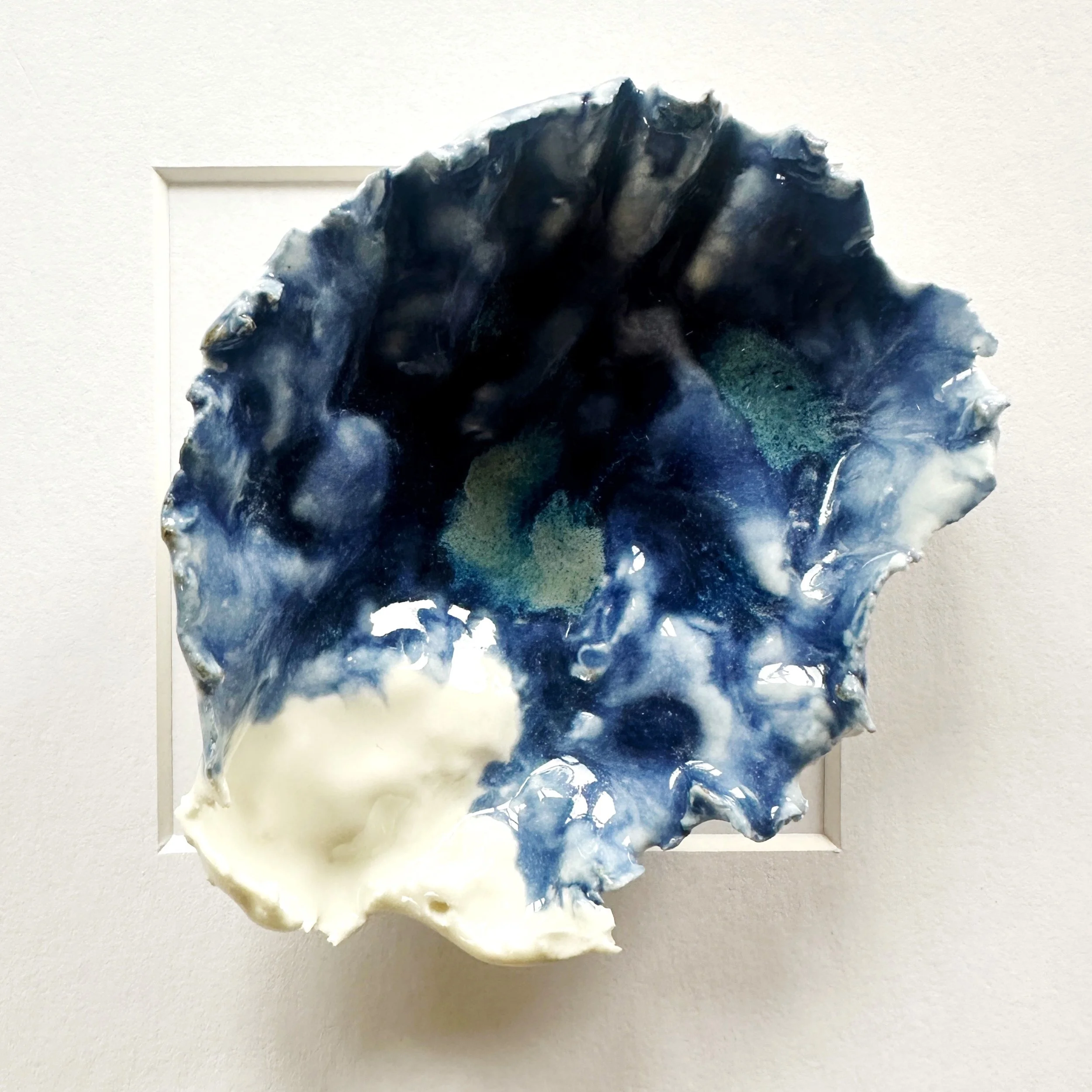 Elegant textured coastal wall art featuring sculpted porcelain shells