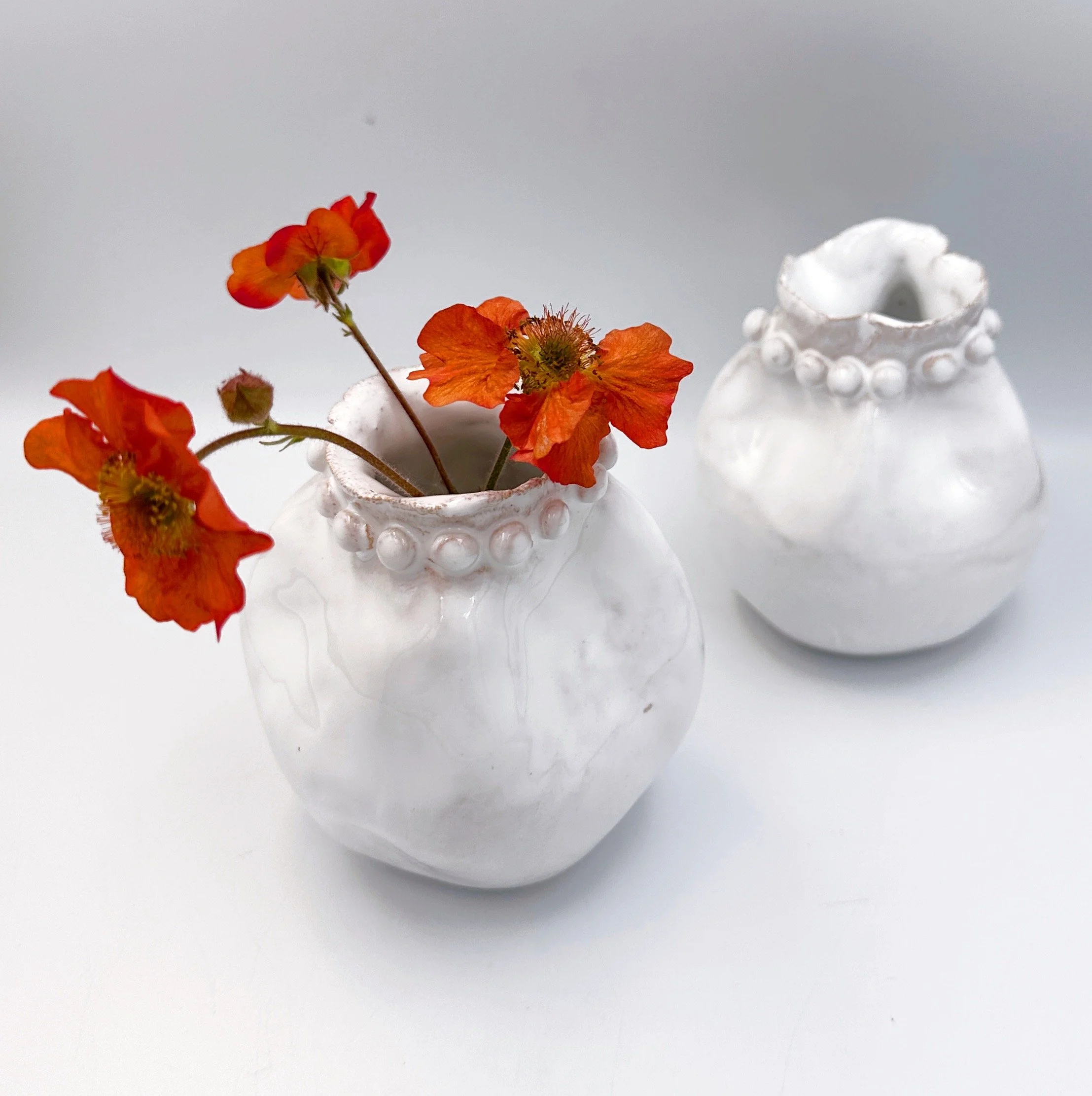 white ceramic single bud vases