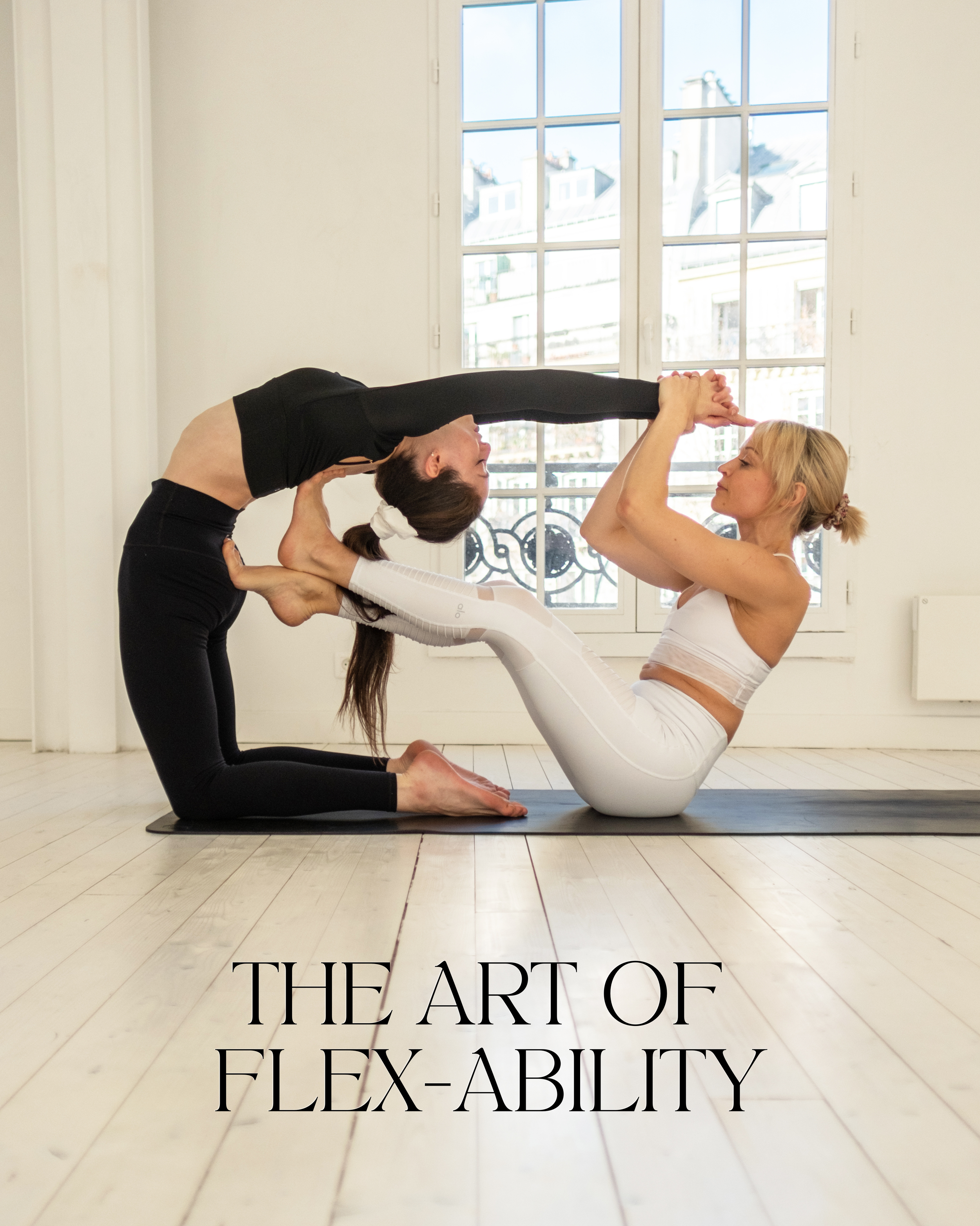 Two young women doing yoga asana double downward dog. Adho mukha