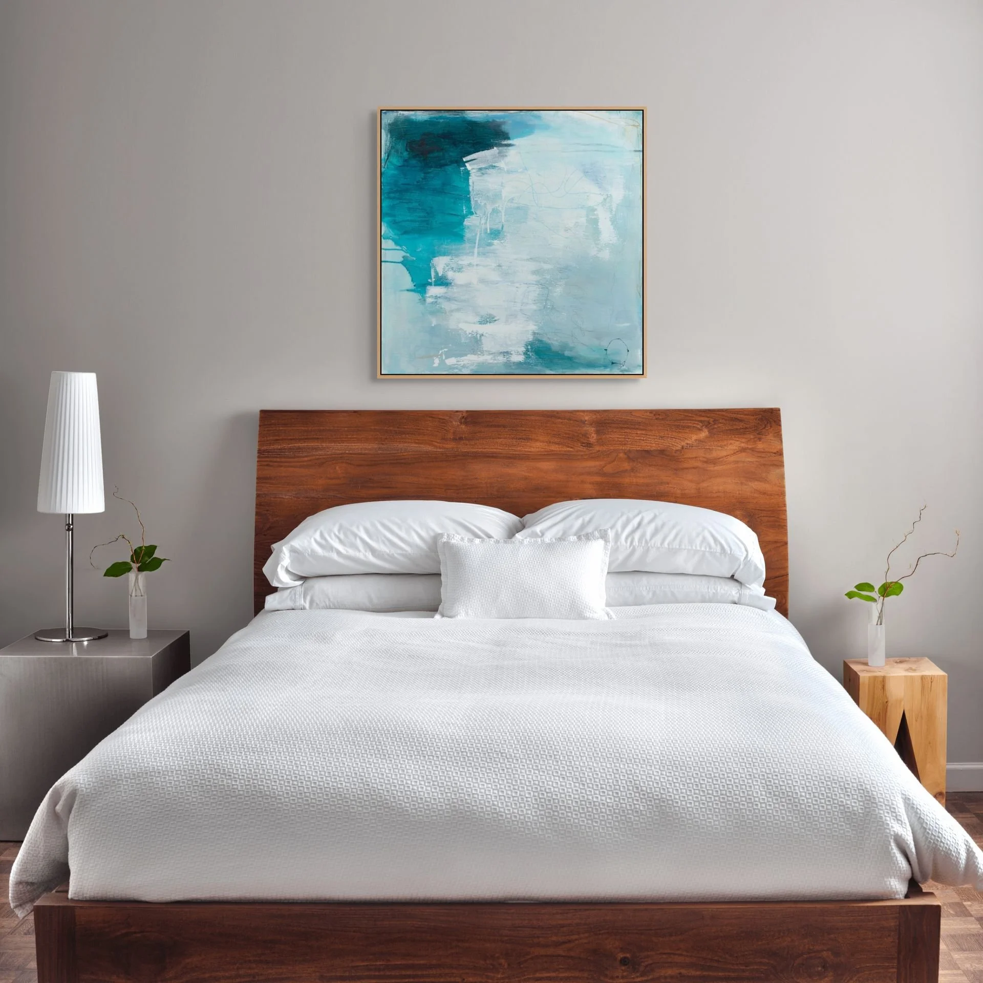 Blue and white contemporary abstract art print by Laurie Baars adds a calming touch to a modern bedroom.
