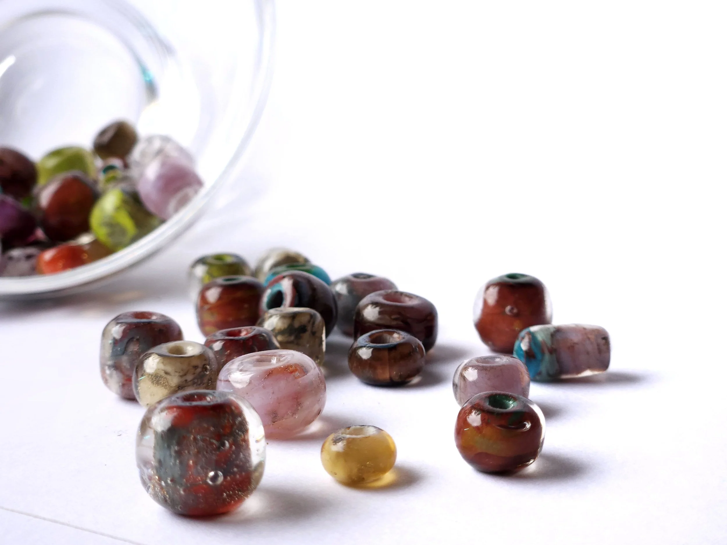 Glass lampworked beads, colored glass with transparent. Simple glass beads. 