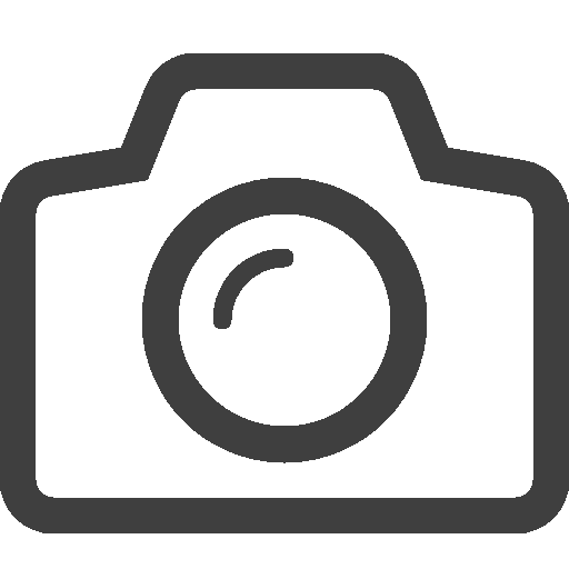 A camera icon in zwart en grijs.
