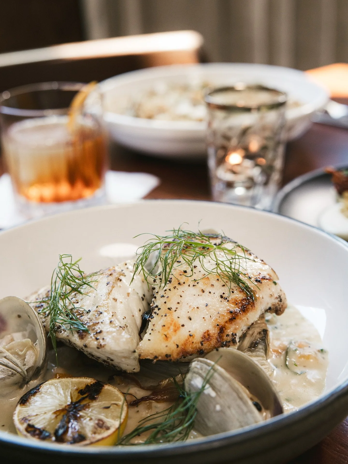 Cozy meets coastal 🐟🍲 Pan Seared Halibut with creamy New England clam chowder, braised fennel + charred lemon. ✨ The perfect way to spend your Friday night with us!

🐟 - New England Clam Chowder, Braised Fennel, Charred Lemon.