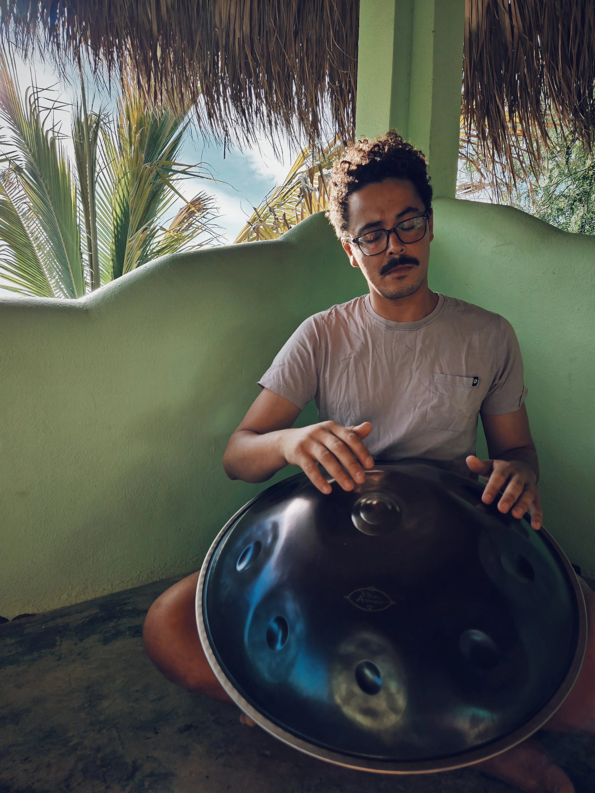 musician playing live steel drum during practice
