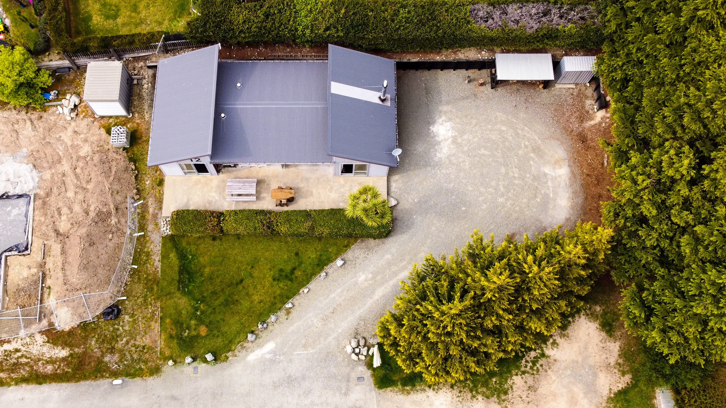 Drone photograph revealing property boundaries and outdoor space.jpg