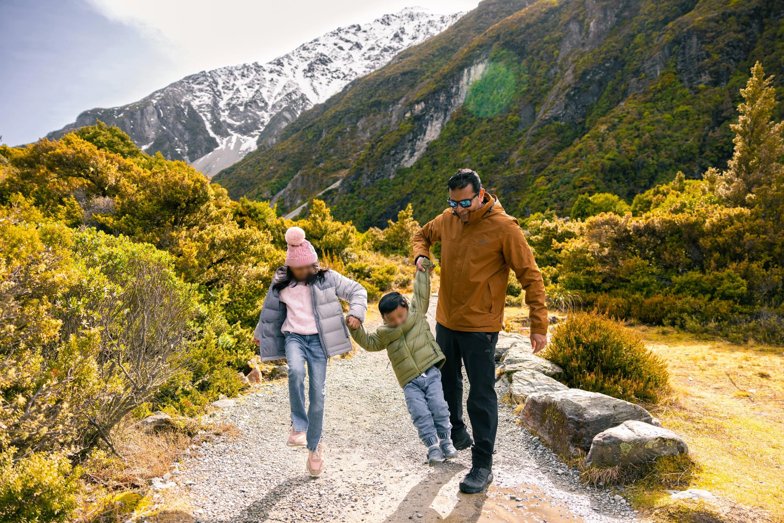 Family standing together with glaciers and mountains near Mount Cook.jpg