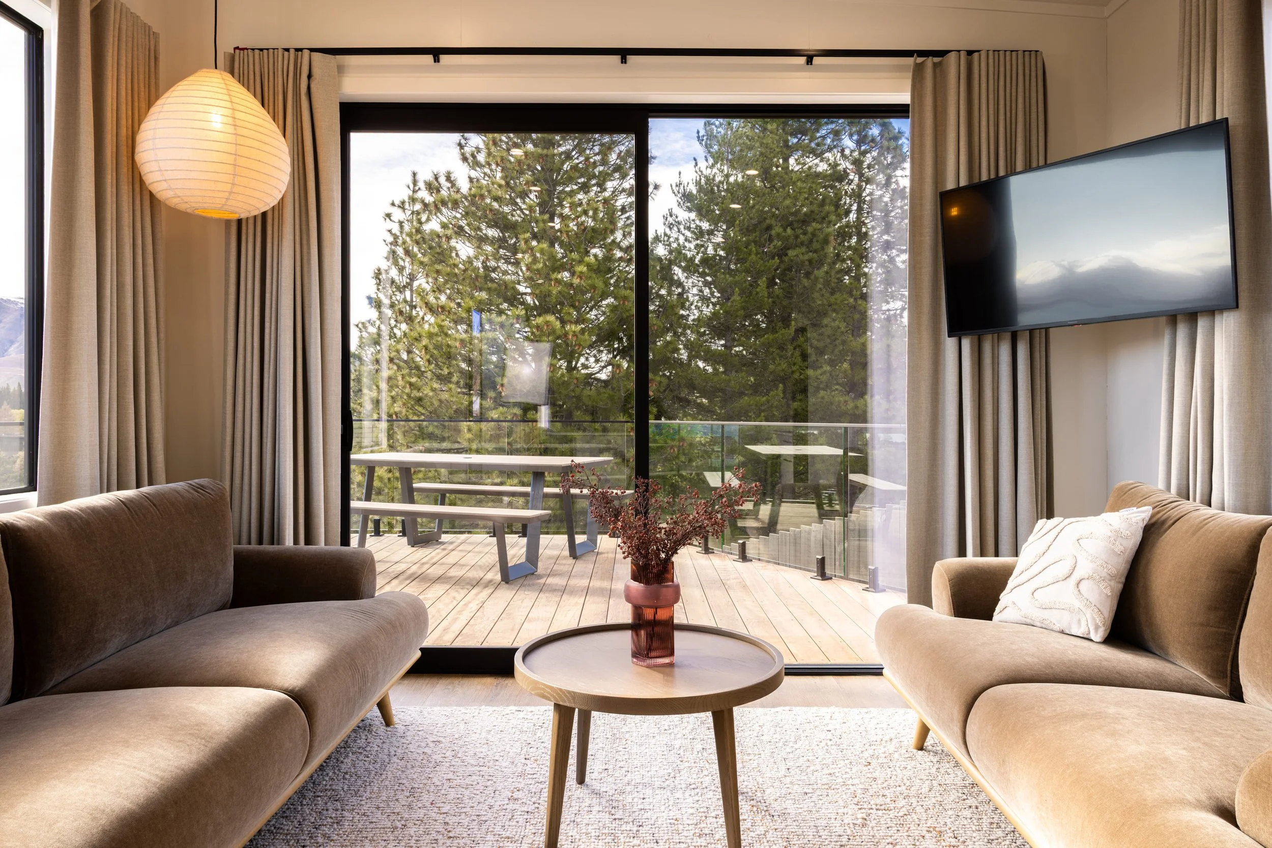 Living room with pine tree views in Tekapo home