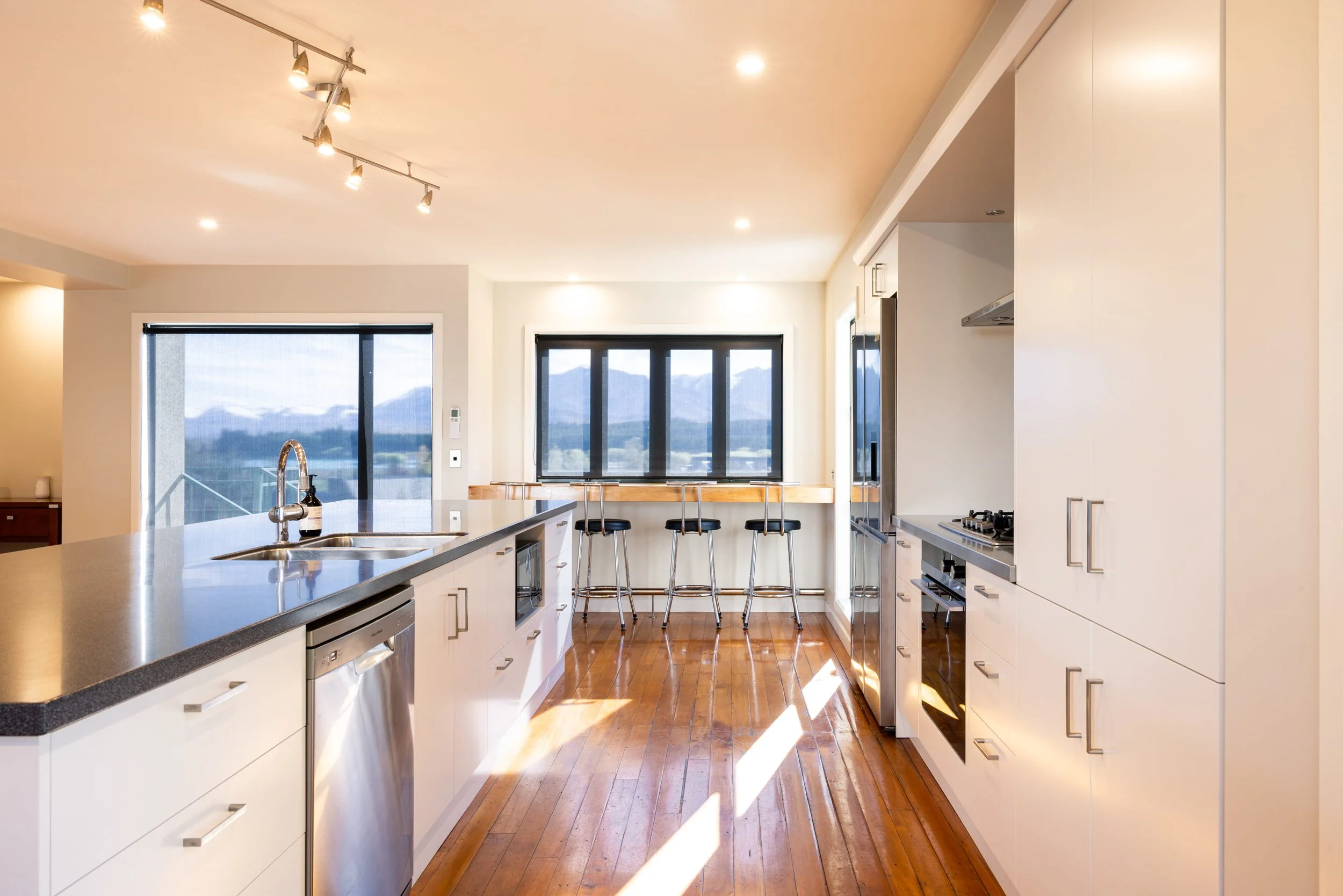 Contemporary kitchen showcasing cabinetry and bench space.jpg