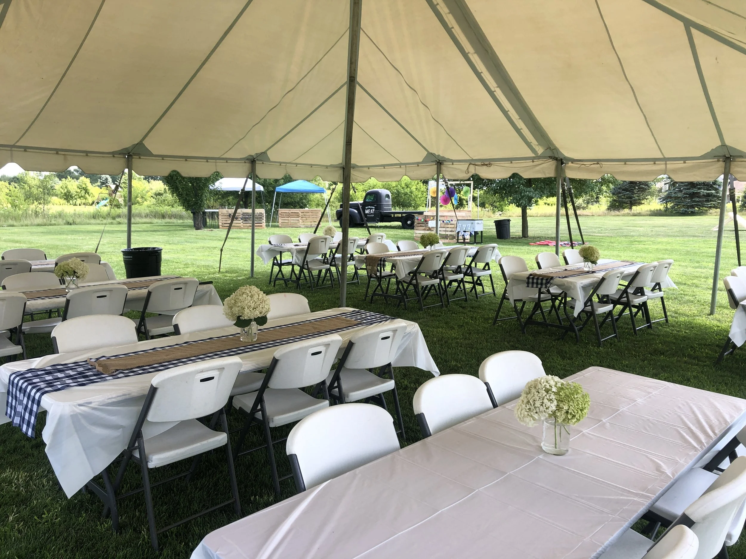 30'x30' Formal tent with 8' banquet tables and formal chairs