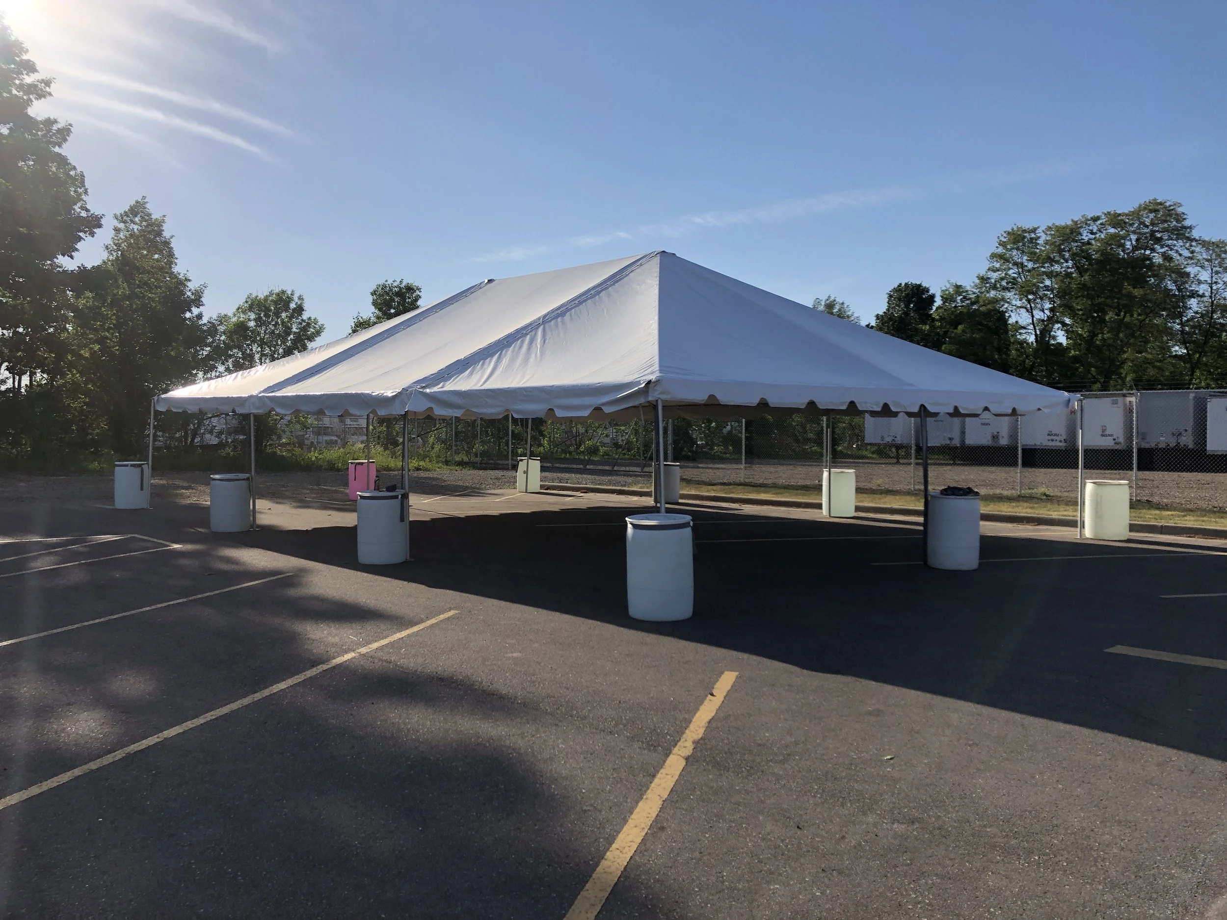 30'x45' frame tent with water barrels