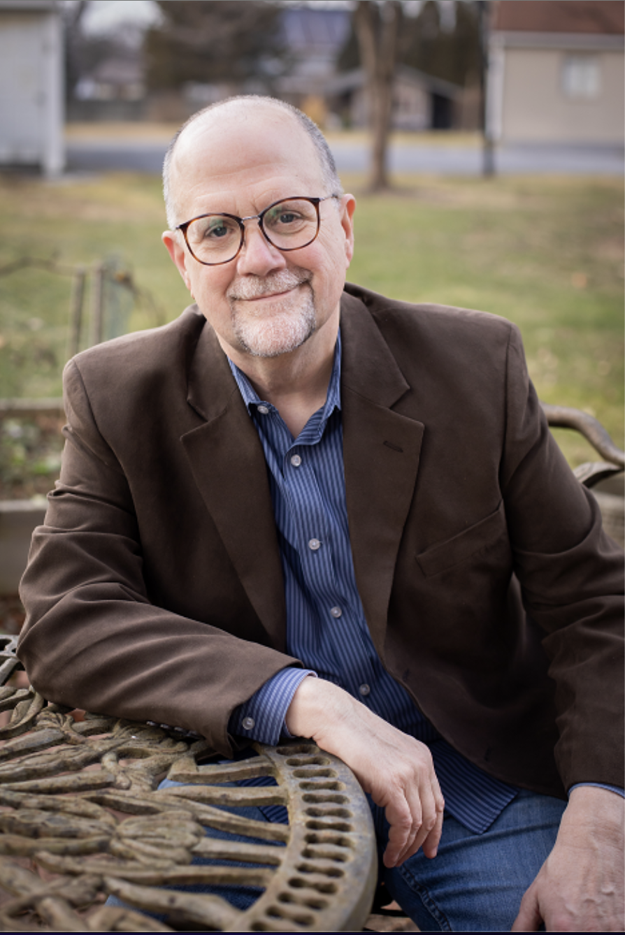 Headshot of Judd Mellinger-Blouch, who had professional public speaking training from D'Arcy.