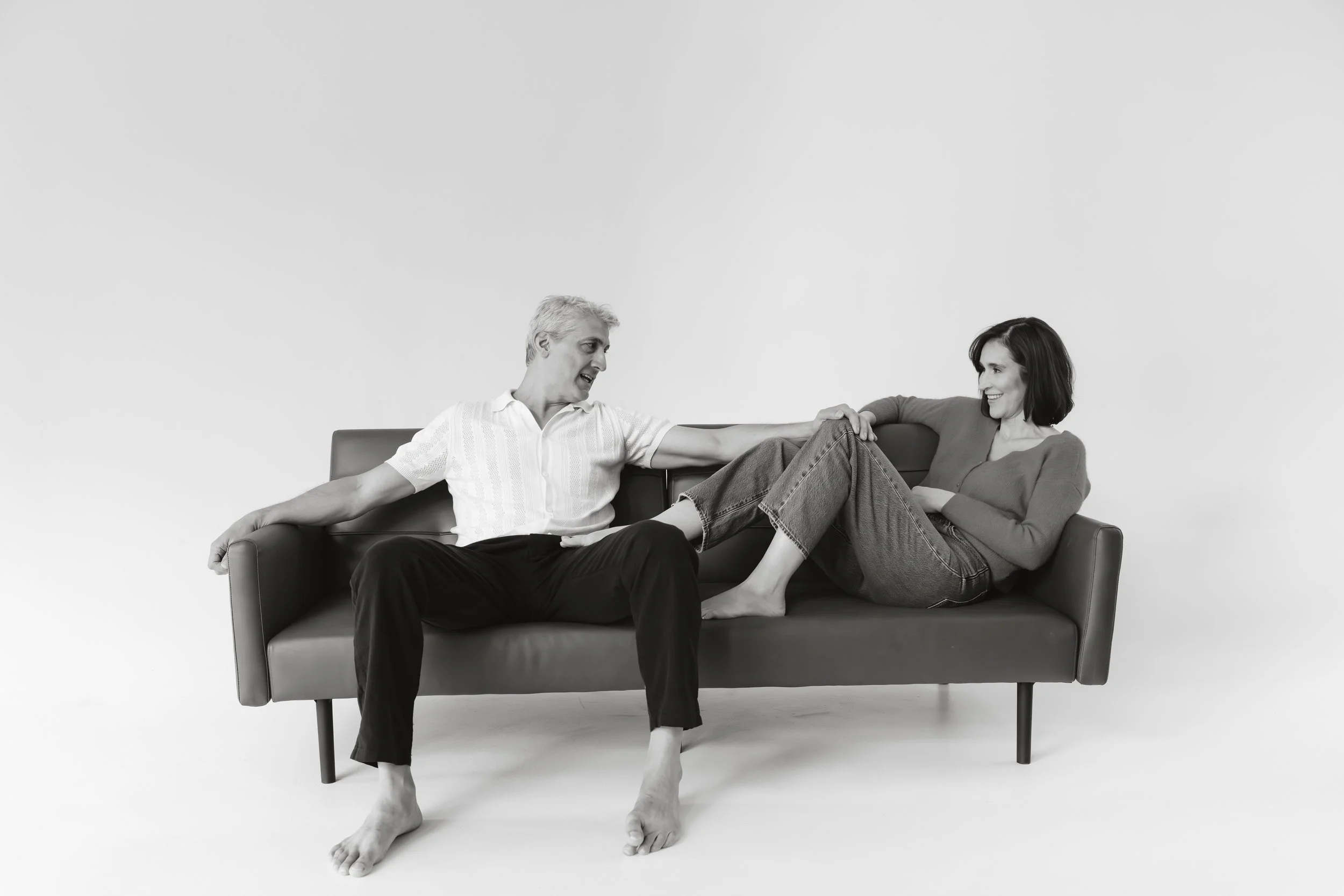 Chris & amy whole couch casual laughing 2 Horizontal B&W.jpg