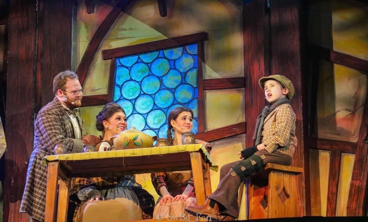 December 2025 - Lauren heads back to Busch Gardens Williamsburg to perform in the 11th annual production of "Scrooge No More!" playing Mrs. Crachit. 
Left to Right - Noah Gross, Lauren Moore, Amanda Sweeney, and Tiny Tim! 