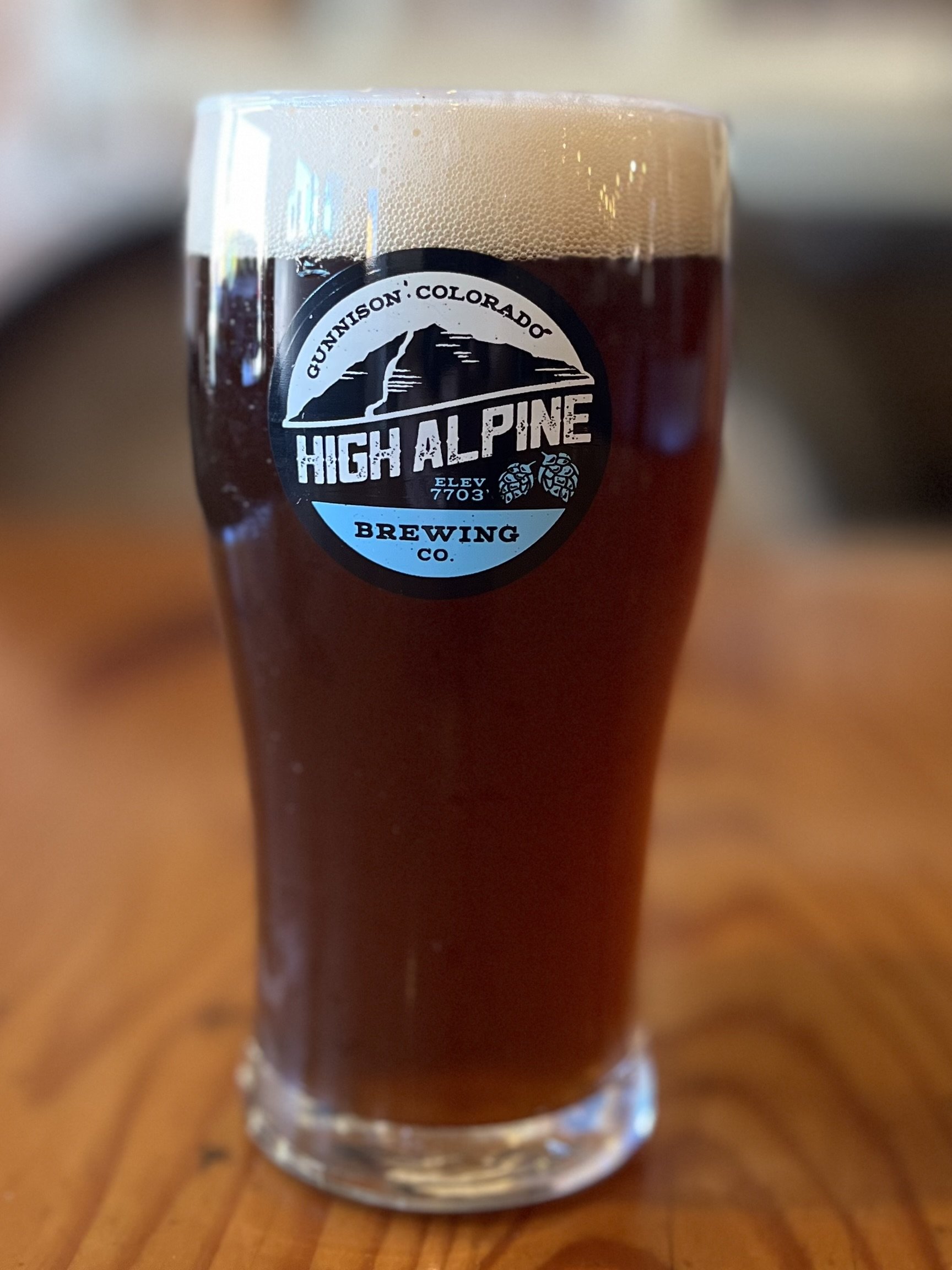 Brown beer with clarity on a table