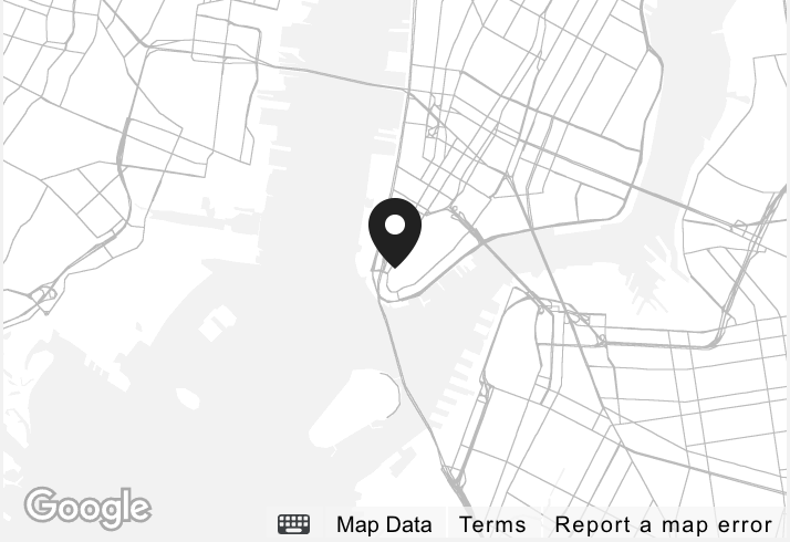 Map with a marker at a specific location, showing streets and water bodies in the surrounding area.