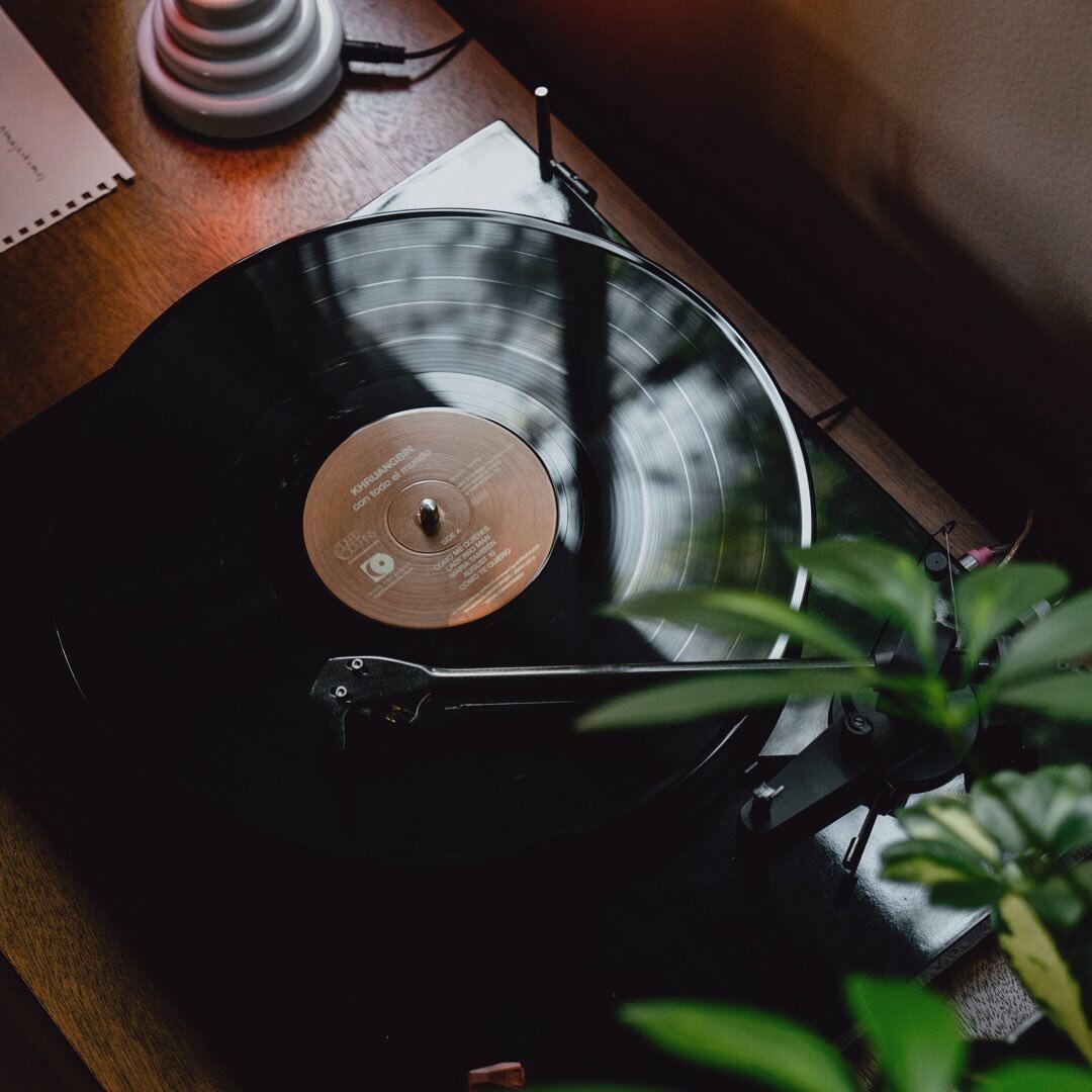 When was the last time you put on a vinyl record?
.
#SiouxFalls #EnergyWork #FunctionalMedicine #HolisticHealthCare #FeelGoodMood
.
.
.
[Image Description: A vinyl record plays on a table next to a lamp, a plant, and the window.]