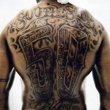 INSIDE THE INDUSTRY:                                       LASER TATTOO REMOVAL ,                                                         and THE CANVAS CURATION OF 50 CENT