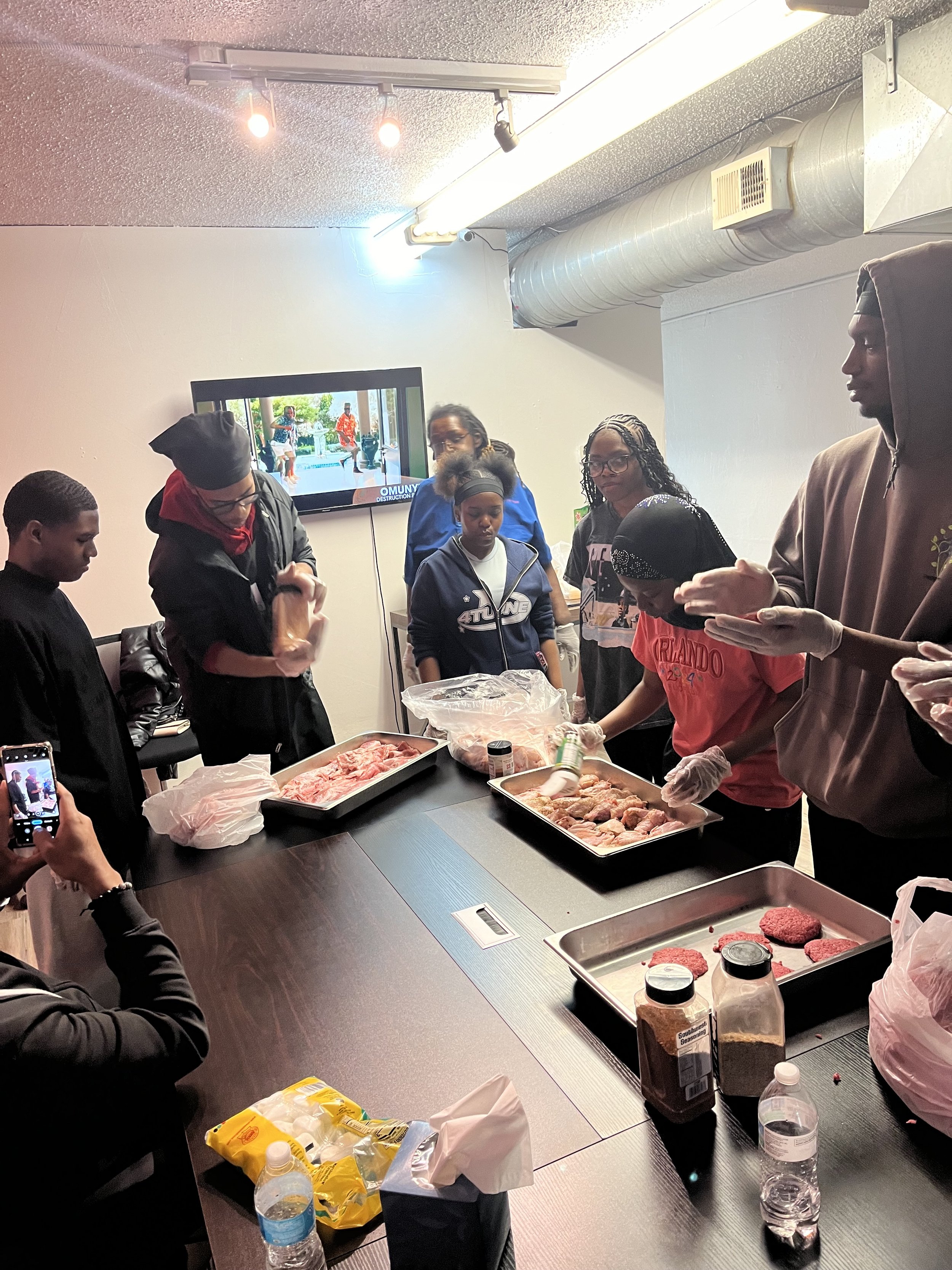 JWBYI's Culinary Arts Outreach program preparing food