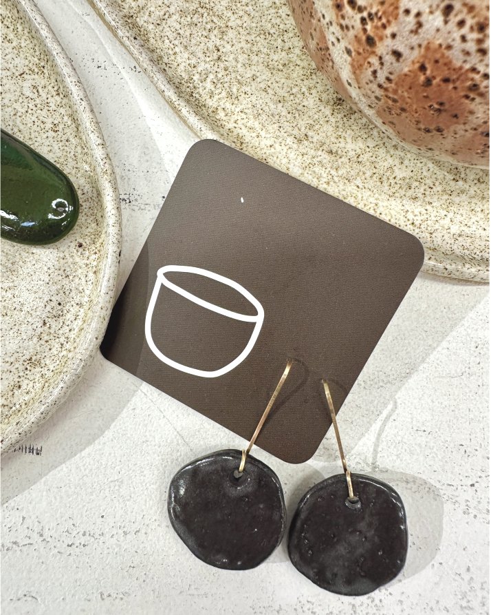 We love these organic shaped ceramic earrings in black clay by Pukka Pottery. Currently available here at SSG during our Land and Sky exhibition. #landandsky #ceramics #handmade #uniquegifts #makers #supportlocalartists #sunshinecoastgallery #buyfrom