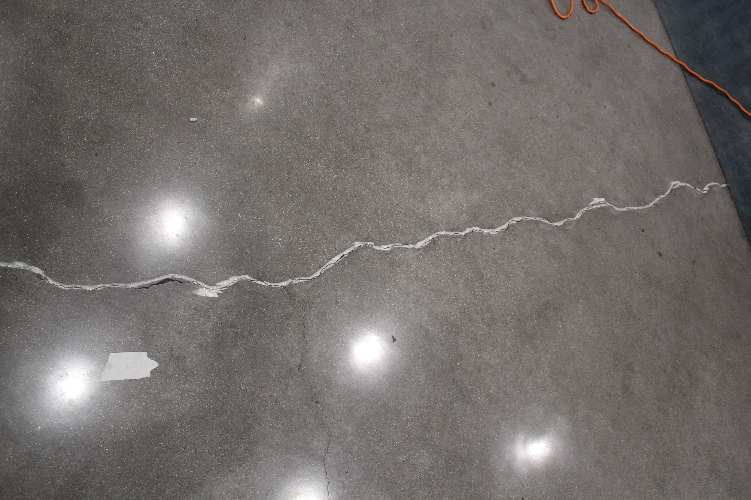 Freshly repaired crack in polished concrete.