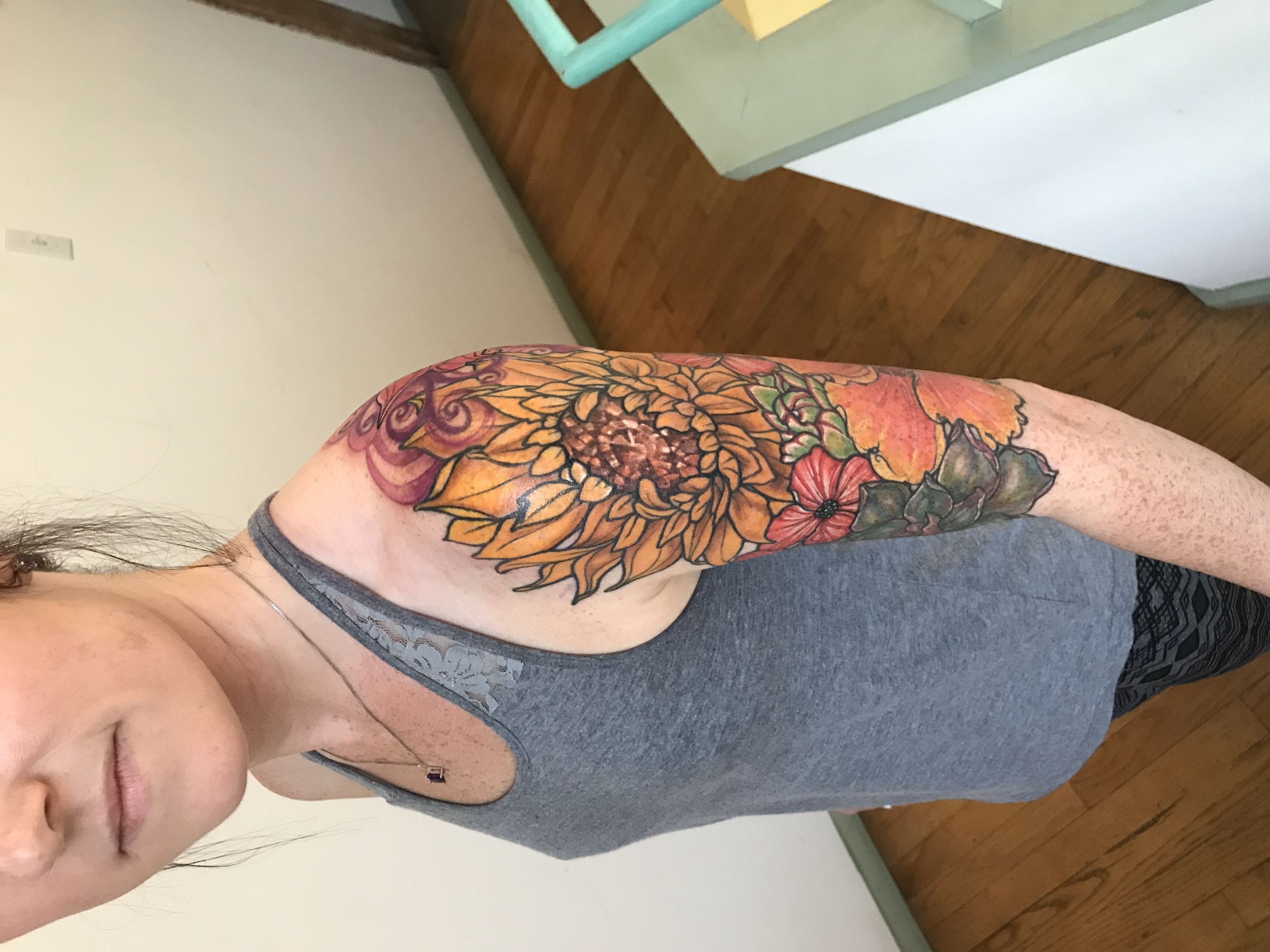 Kathleen had an existing tattoo from a previous artist on her shoulder. She wanted to add a half sleeve of new flowers and connect her old piece with it. We completed all of the new fresh flowers first and then revamped the lily on the shoulder at th