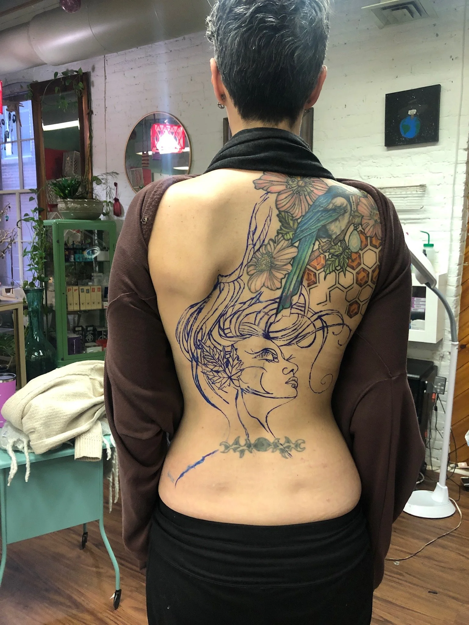 We decided to create a backpiece including a woodland woman. We gave her branch antlers so the magpie would look as though it was always a part of this much larger piece of art we were now making. This made it so much fun, it was like as if she alway