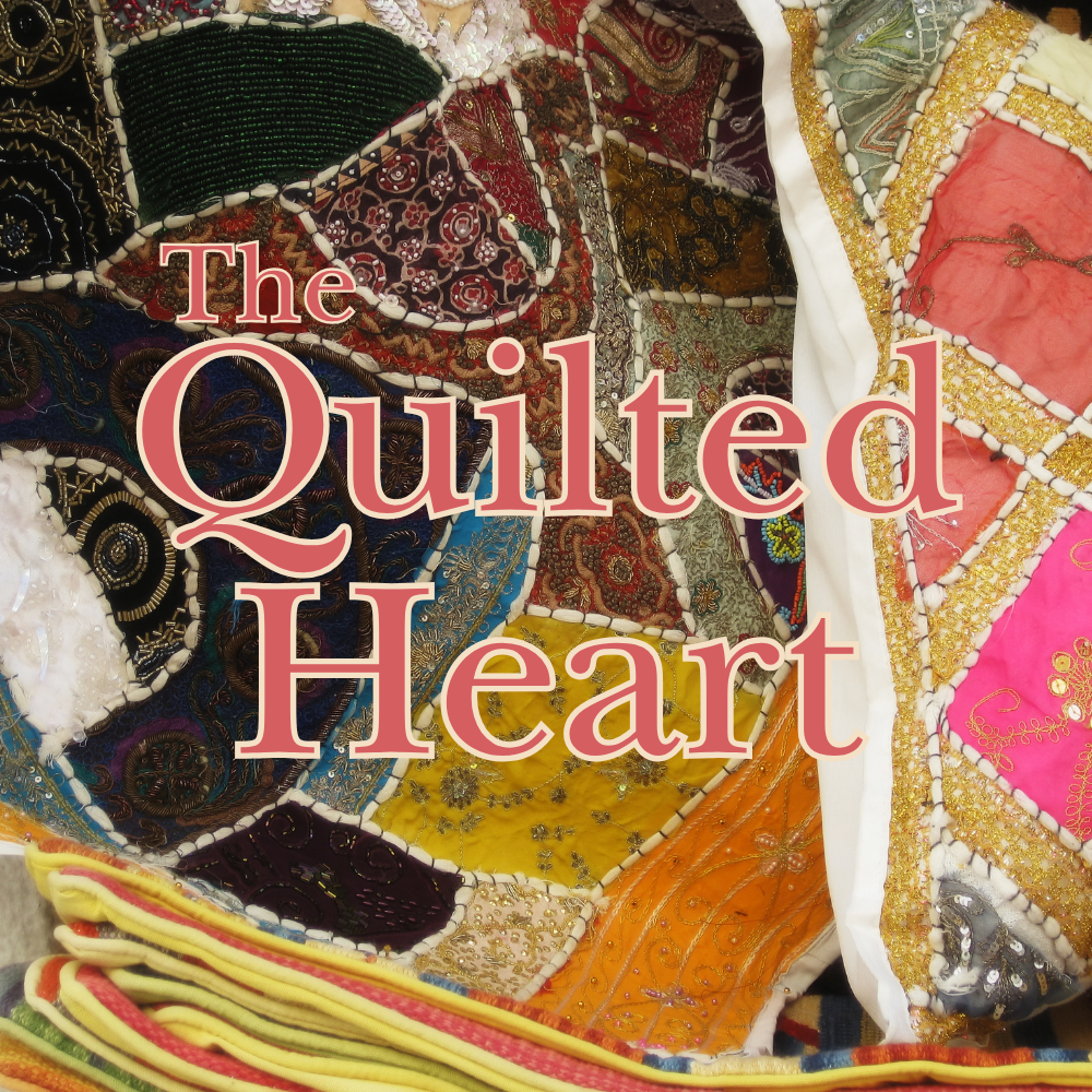 Close-up of a colorful quilt with intricate embroidery and beadwork, overlaid with the text 'The Quilted Heart'.