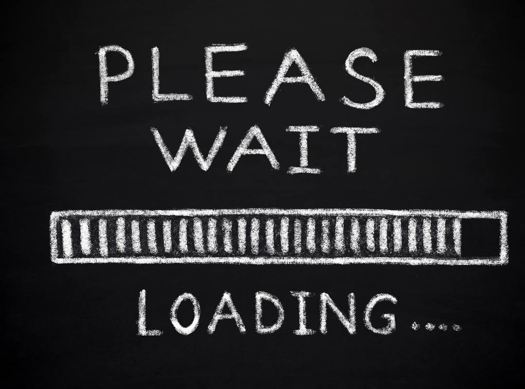 Chalkboard with the message 'Please wait' and a loading bar underneath, with the word 'Loading...' at the bottom.